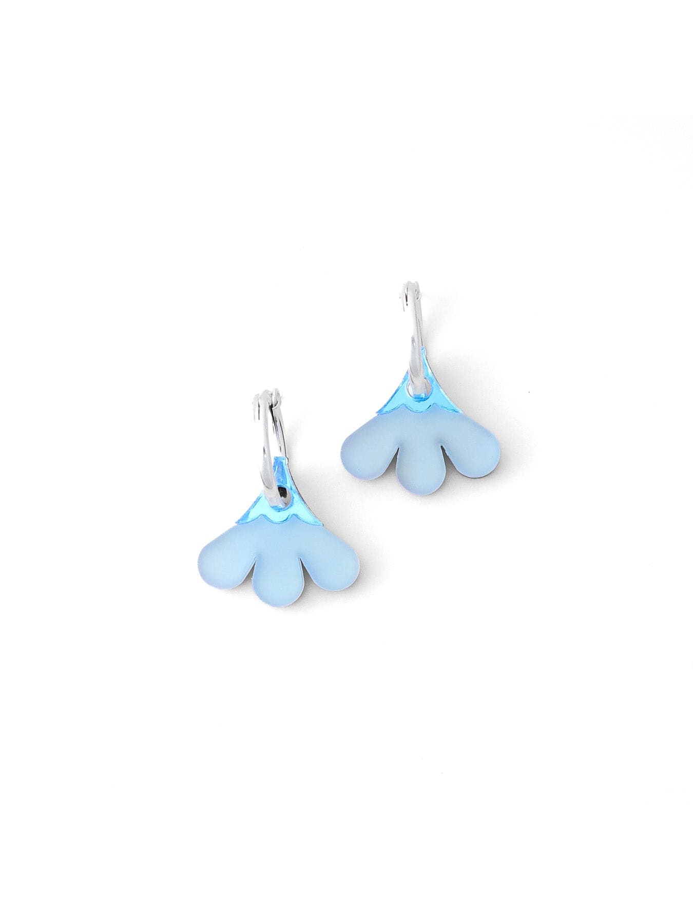 Blue floral drops, smooth frosted resin, semi-transparent glow, petite fan shape with scalloped neckline, modern minimalist look on silver hoops #color_blue