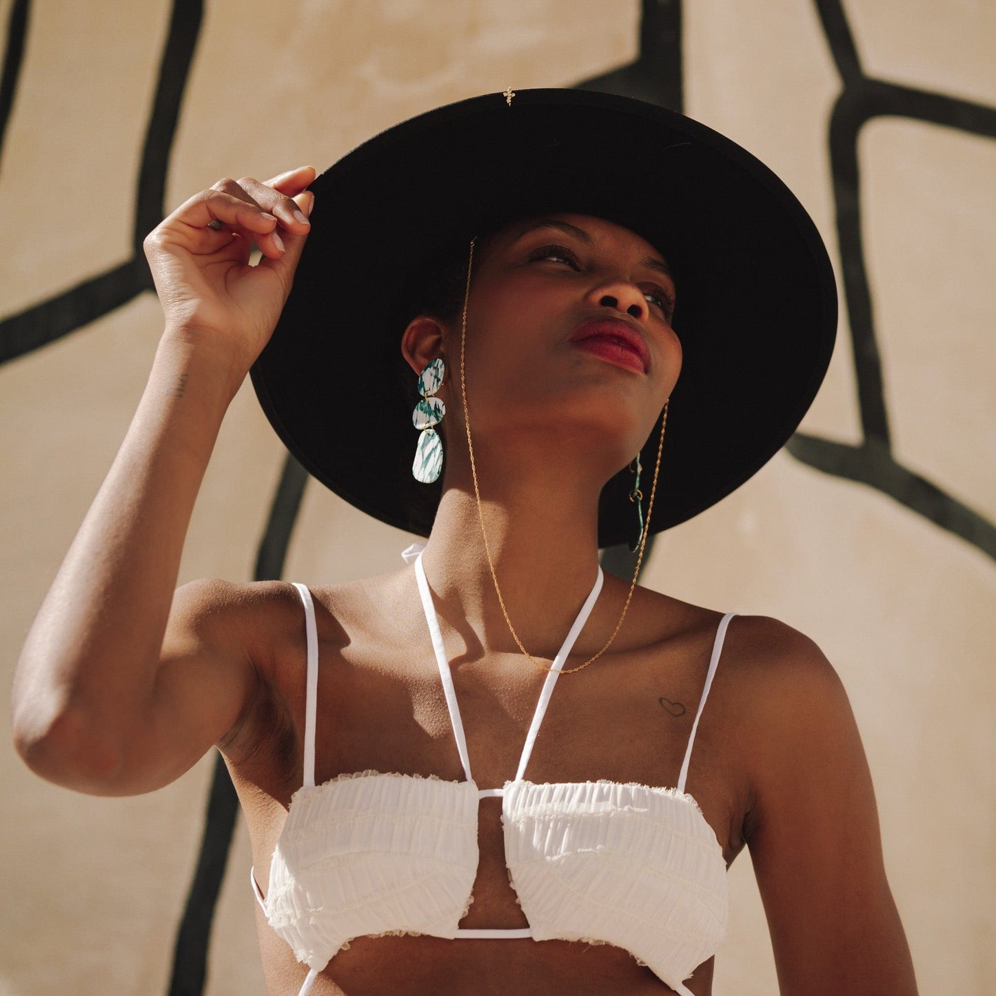 Elegant statement Celestia dangly earrings in italian marble pattern #color_forest-marble