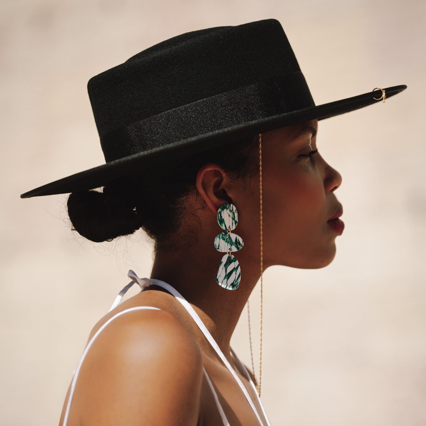 Elegant statement Celestia dangly earrings in italian marble pattern #color_forest-marble