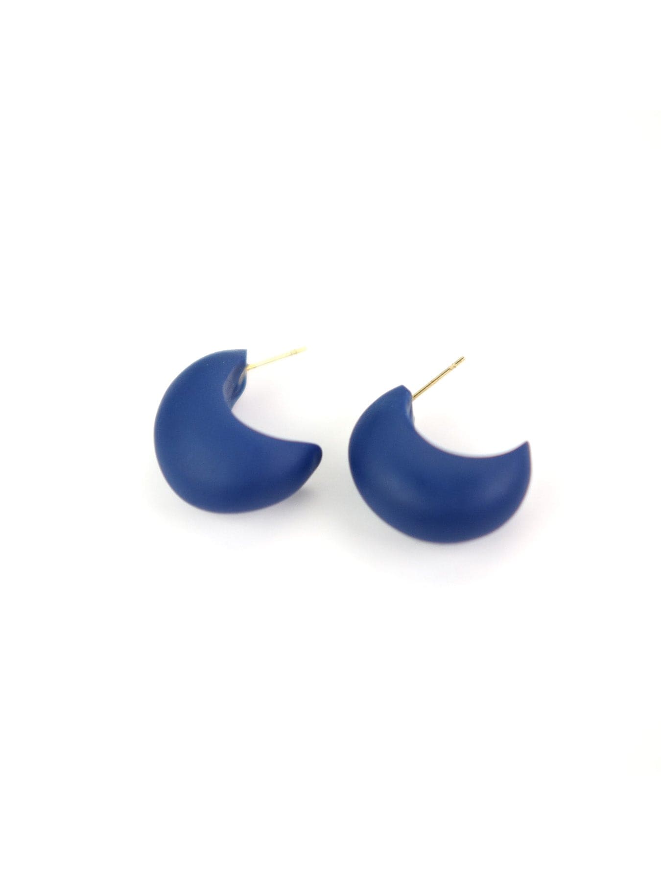 Chubby crescent huggie hoops, deep navy blue with a velvety matte finish #color_navy