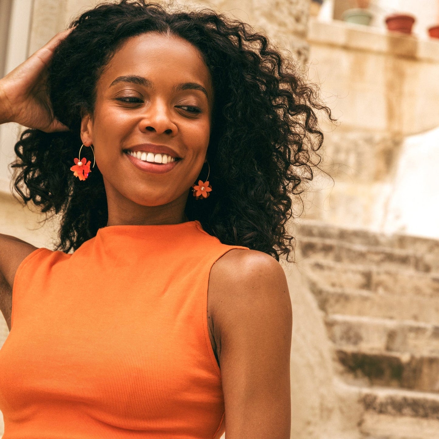 Playful Flowerball dangly earrings with freshwater pearls in coral #color_coral