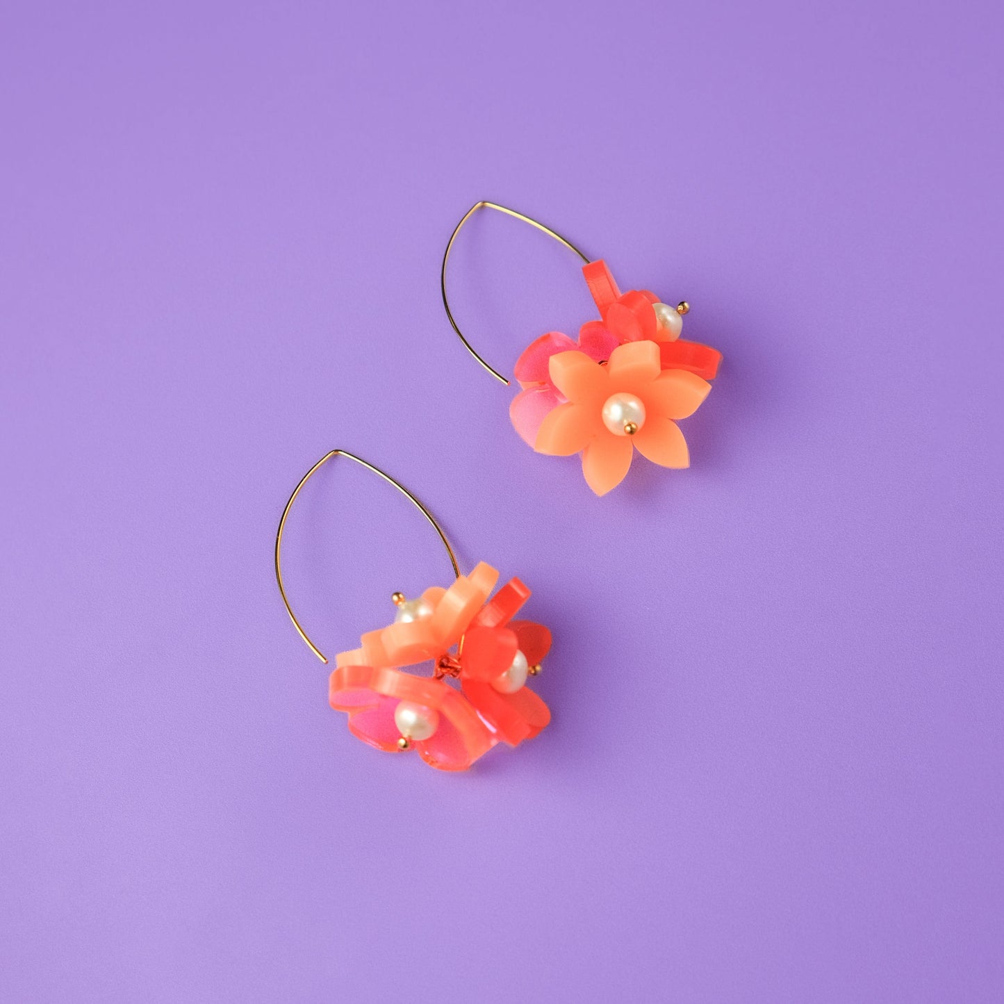 Playful Flowerball dangly earrings with freshwater pearls in coral #color_coral