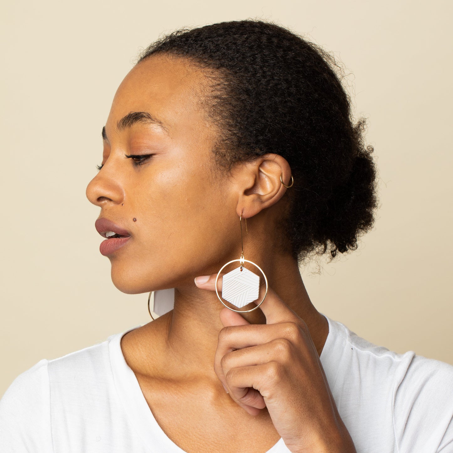 Hex Halo Dangly hexagon shaped elegant and lightweight white and gold earrings #color_white-textured-lines