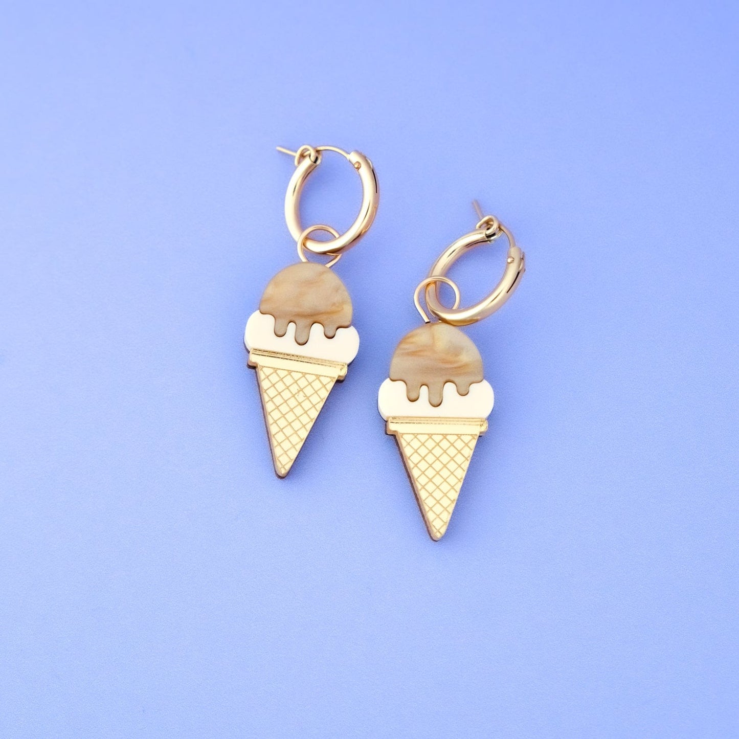 Ice cream cone charm earrings, glossy gold huggie hoops, marbled caramel scoop with creamy drip, waffle-textured cone pendant, playful summer statement #color_mocha