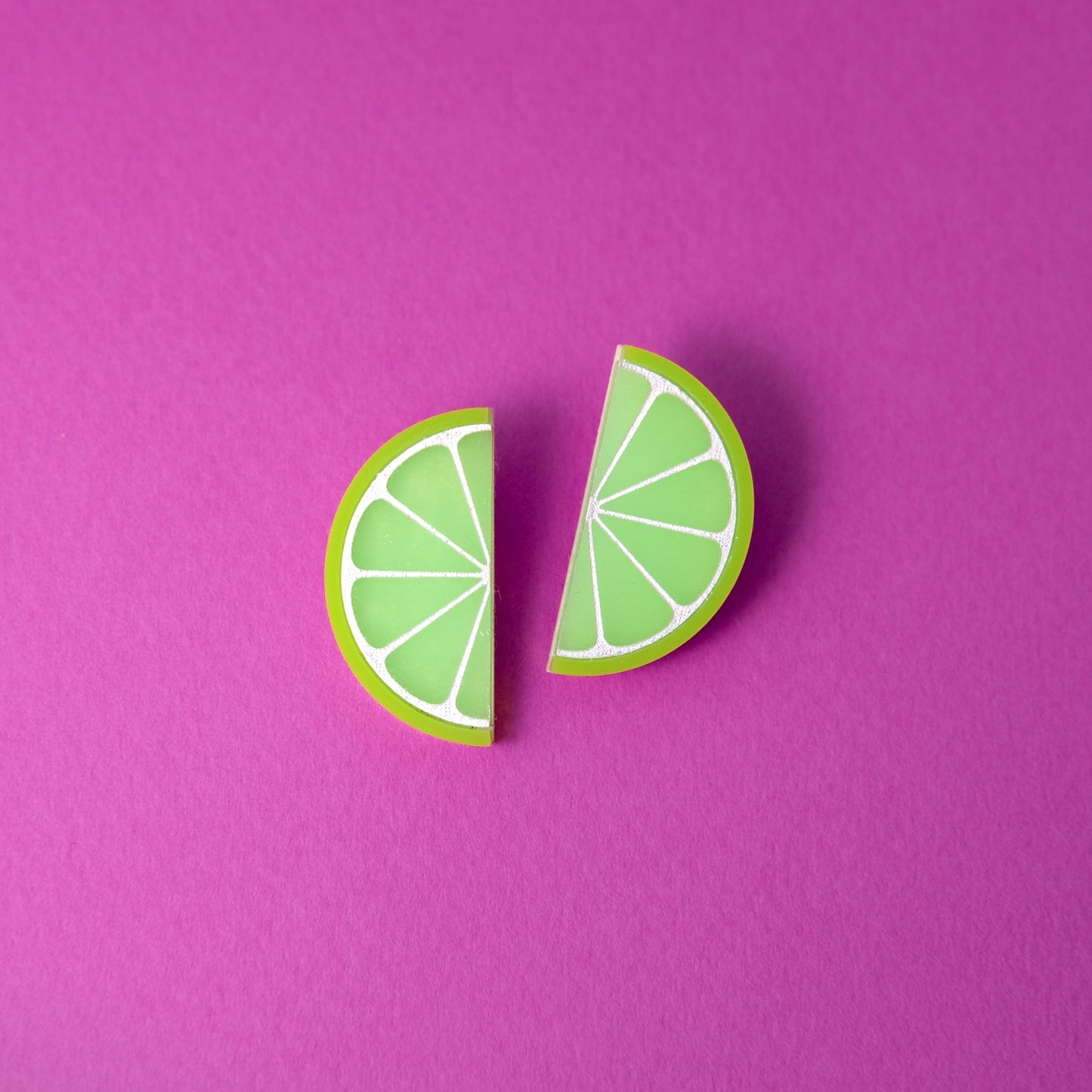Lime slice stud earrings, glossy, lightweight, playful, citrus half-moons with white segment lines #color_green-white