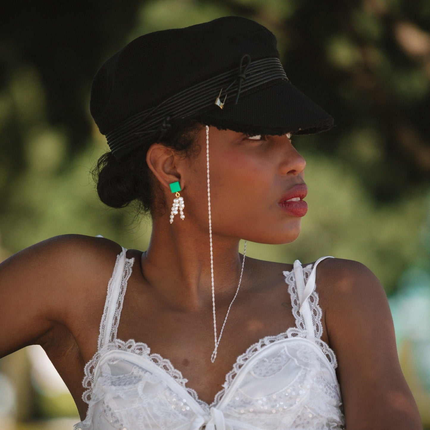 Elegant and fun pearl tassel dangly earrings with a pop of green and 14k gold-filled posts #color_green