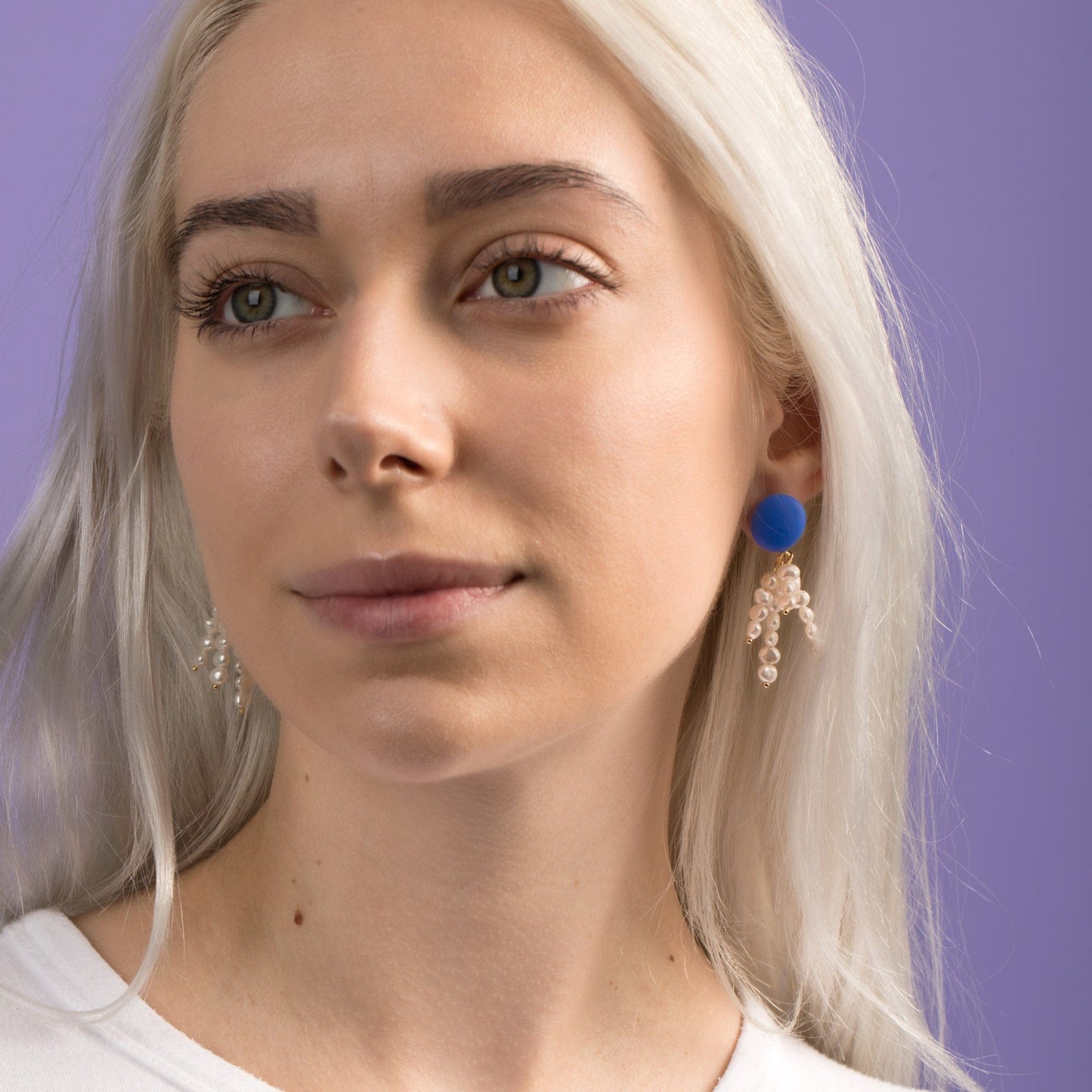 Elegant and fun pearl tassel dangly earrings with a pop of blue color and 14k gold-filled posts #color_blue