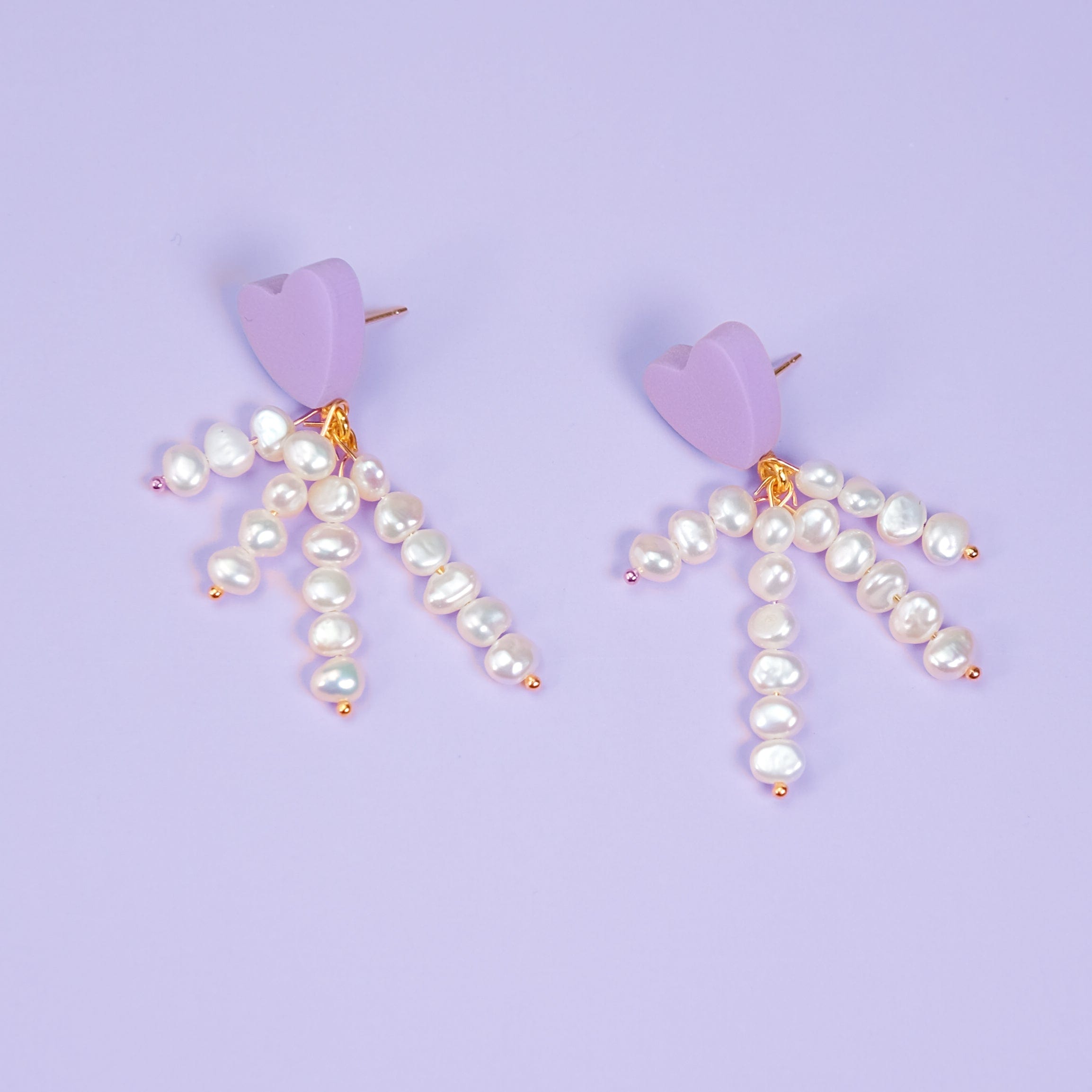 Elegant and fun pearl tassel dangly earrings with a lavender colored hearts and 14k gold-filled posts #color_lavender