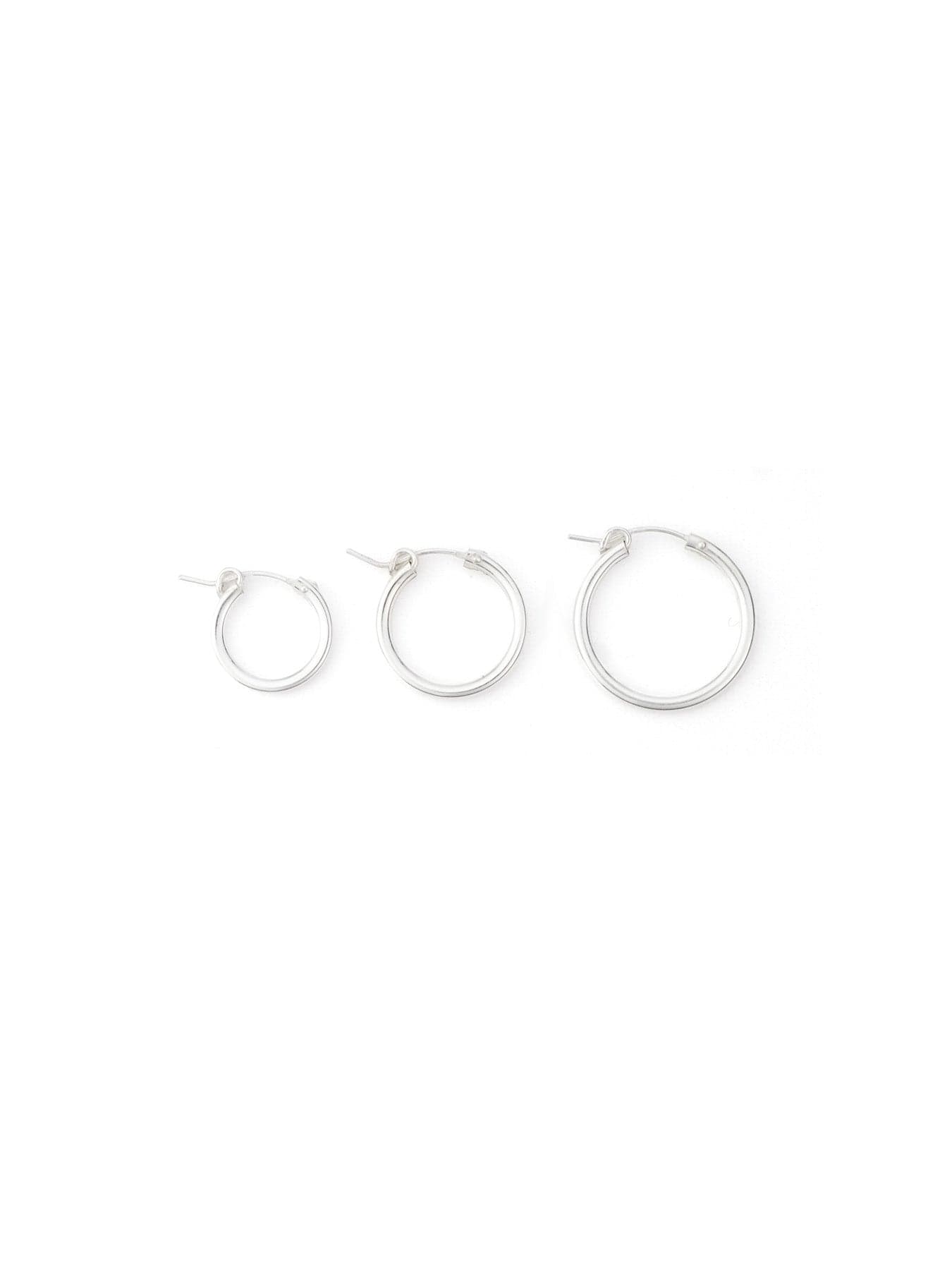 Set of sterling silver hoop earrings, classic, polished, lightweight, three sizes displayed side by side #color_silver