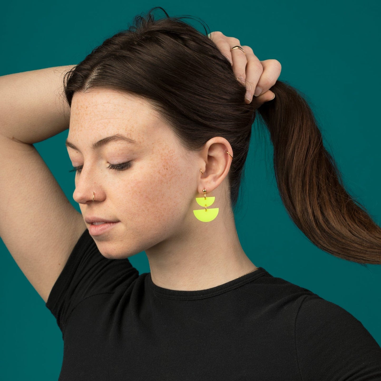 Twin Luna cute dangly half-moon shaped earrings in neon yellow #color_neon-yellow