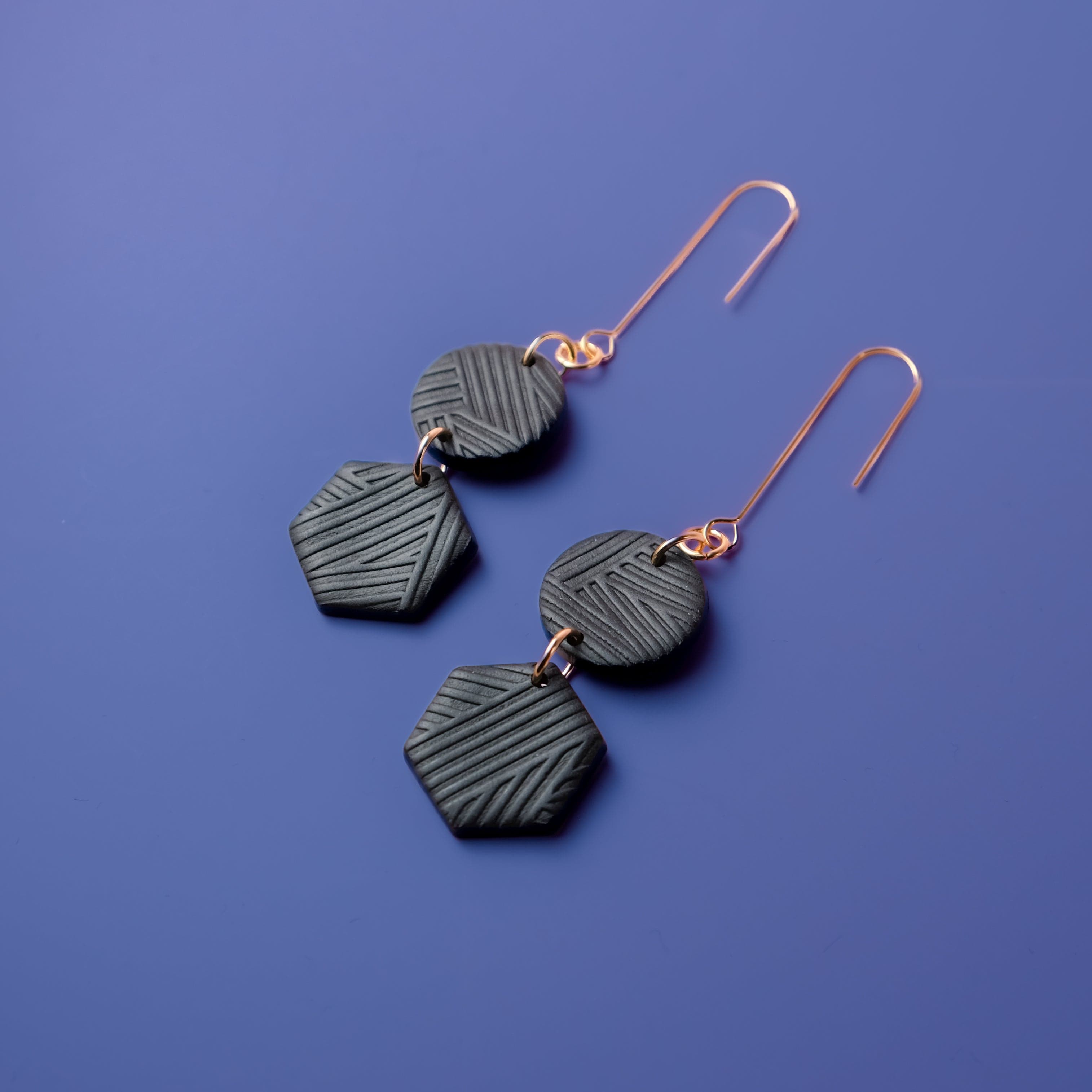 Belle Dangles dangly earrings in textured black #color_black-textured-lines