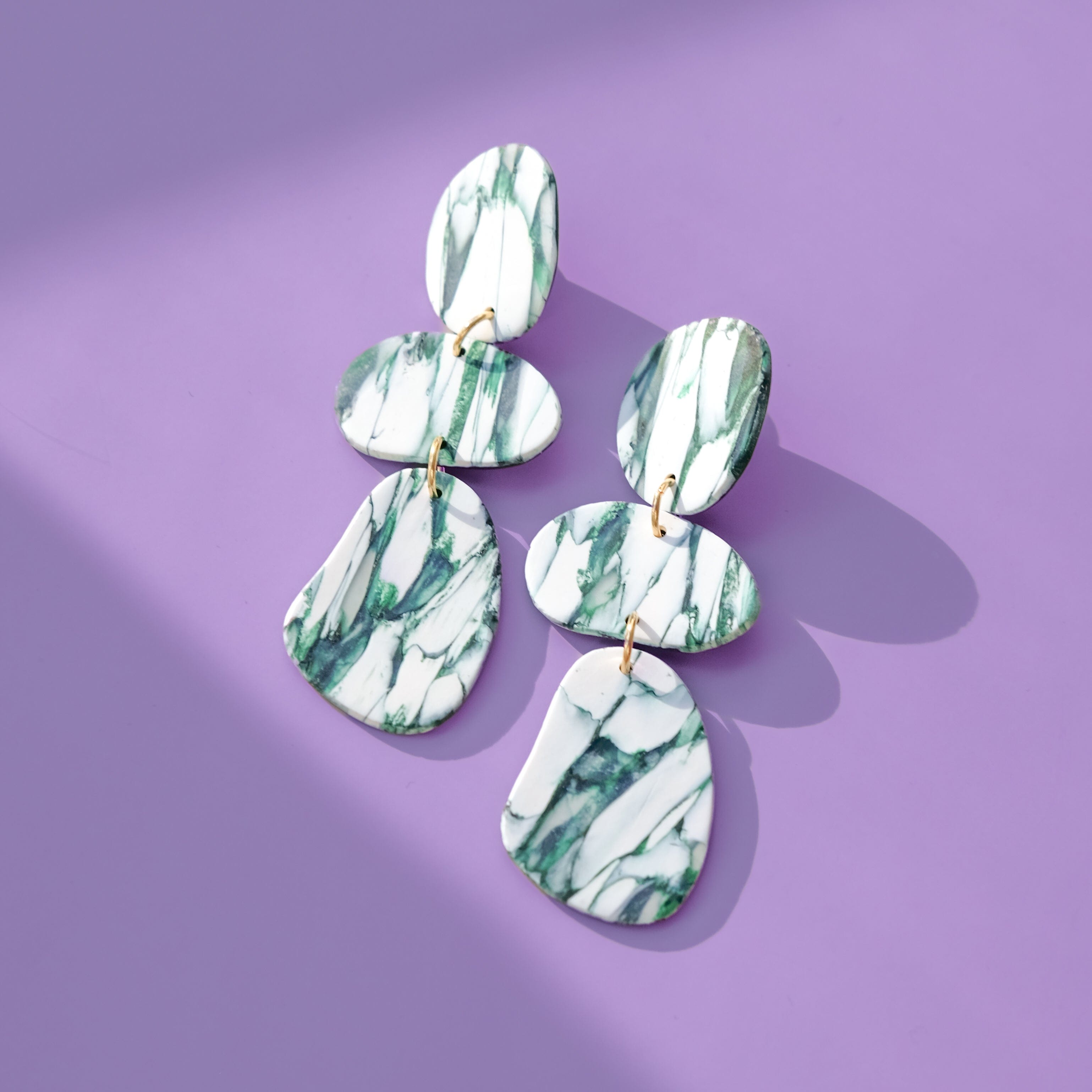 Elegant statement Celestia dangly earrings in italian marble pattern #color_forest-marble