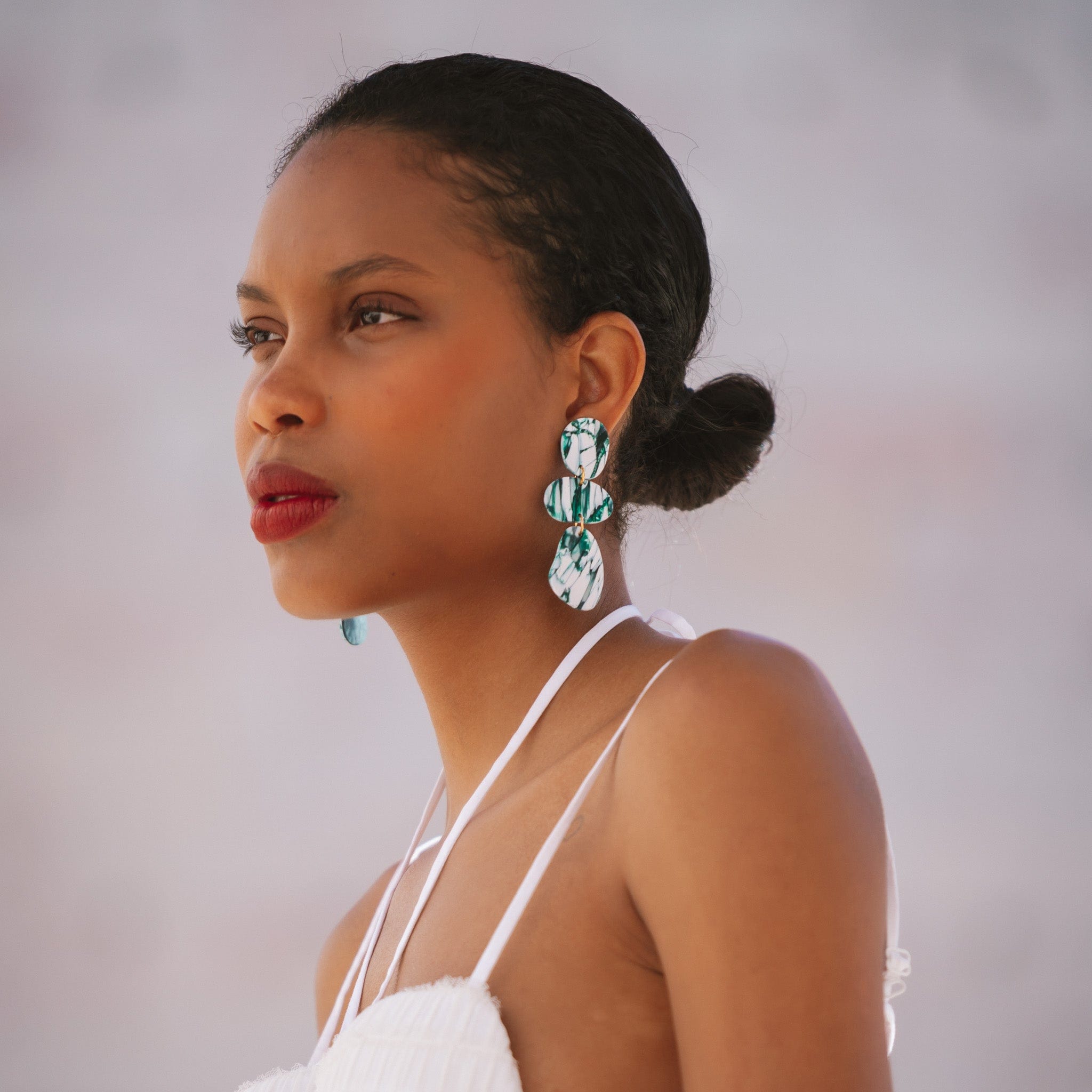 Elegant statement Celestia dangly earrings in italian marble pattern #color_forest-marble