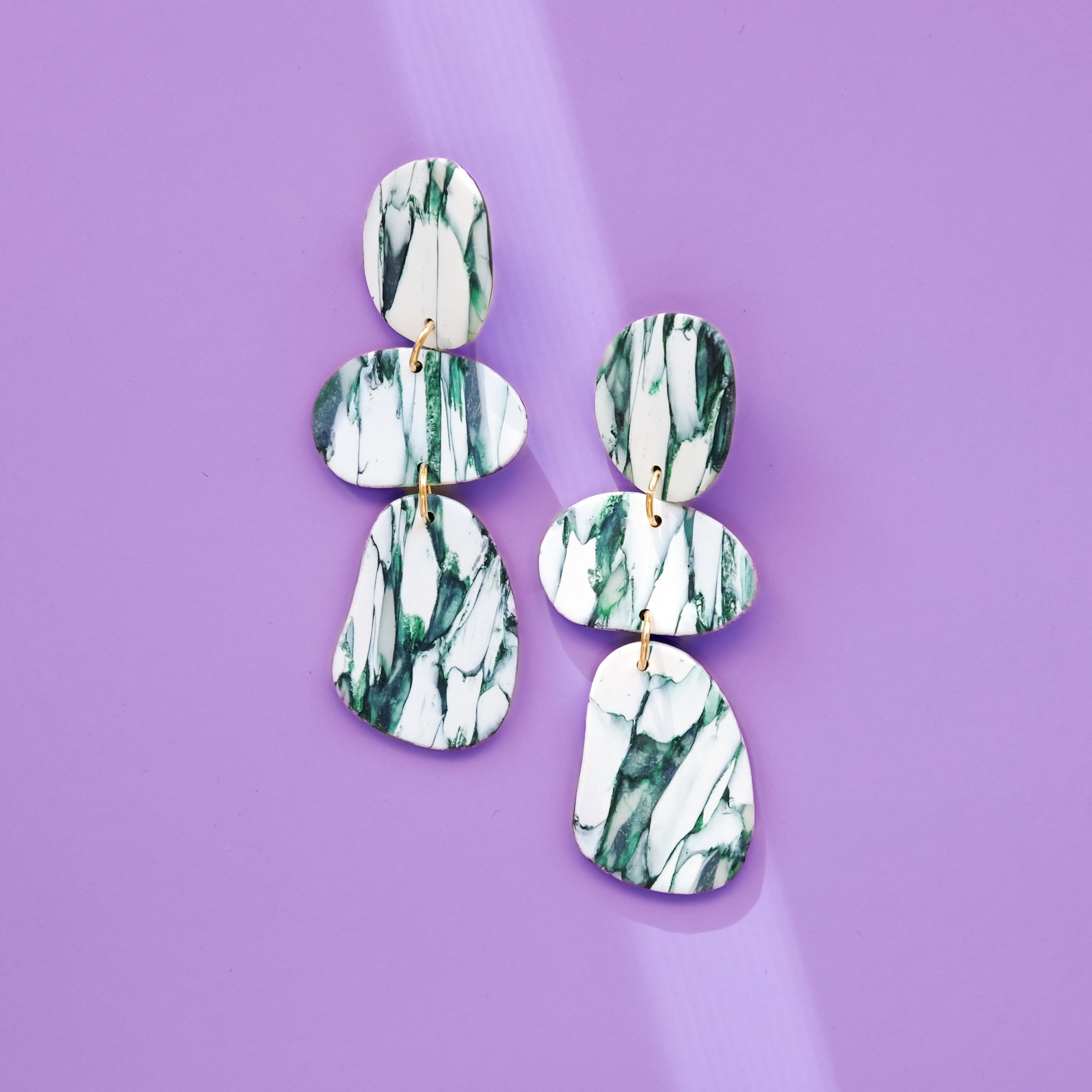 Elegant statement Celestia dangly earrings in italian marble pattern #color_forest-marble