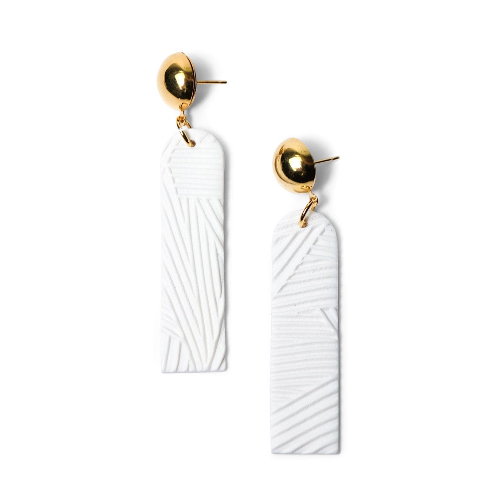 Elegant elongated Chelsea dangly earrings in textured white #color_white-textured-lines