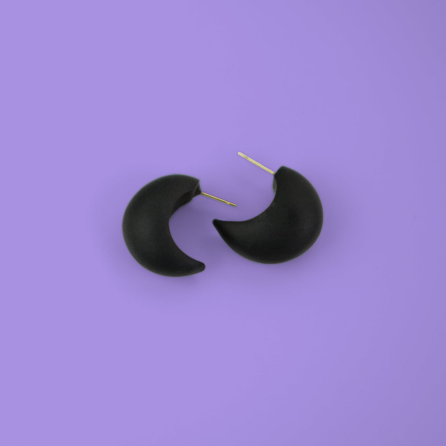 Chunky chubby huggie hoops earrings, statement studs in Black #color_black