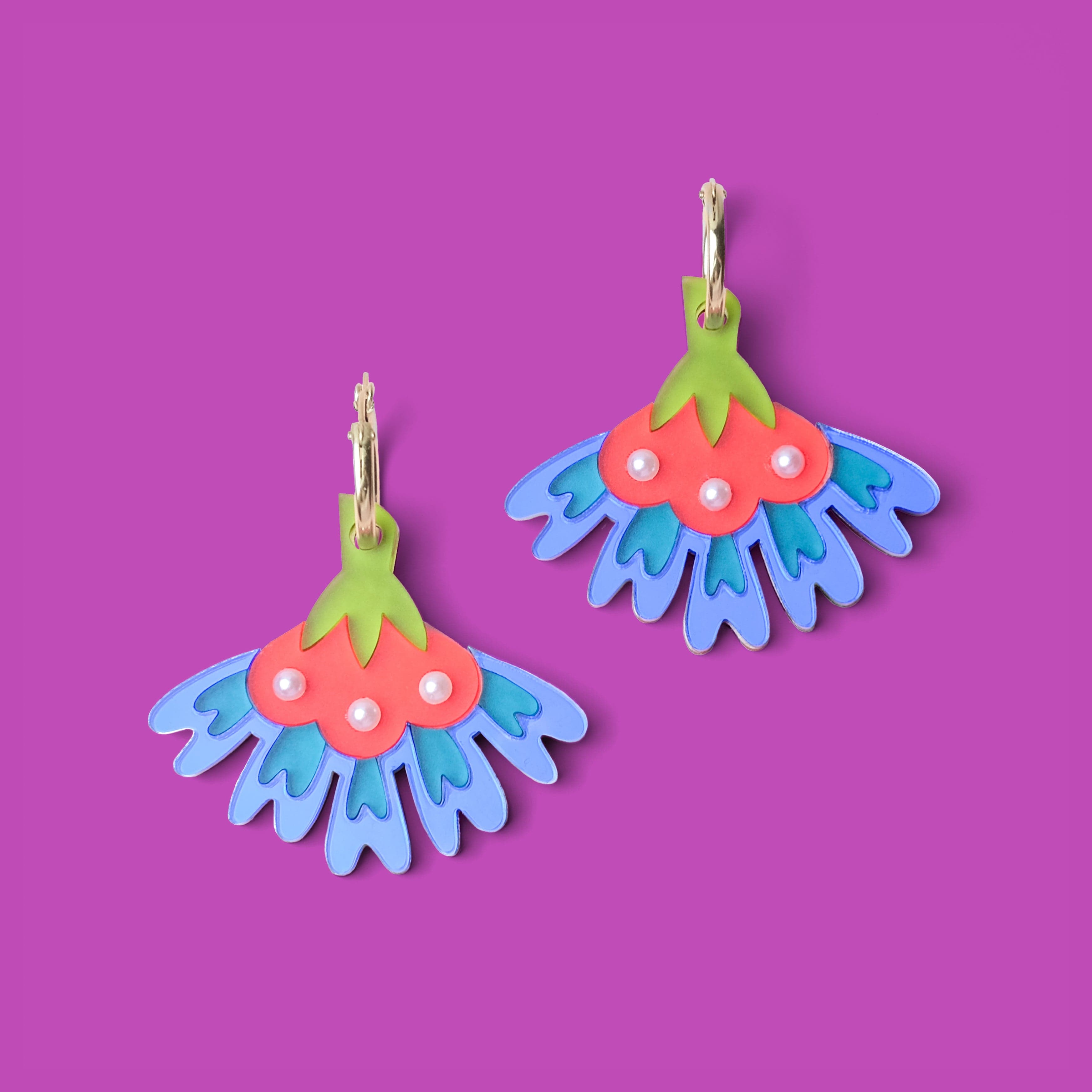 cosmos flower dangly hoop earrings in blue #color_blue