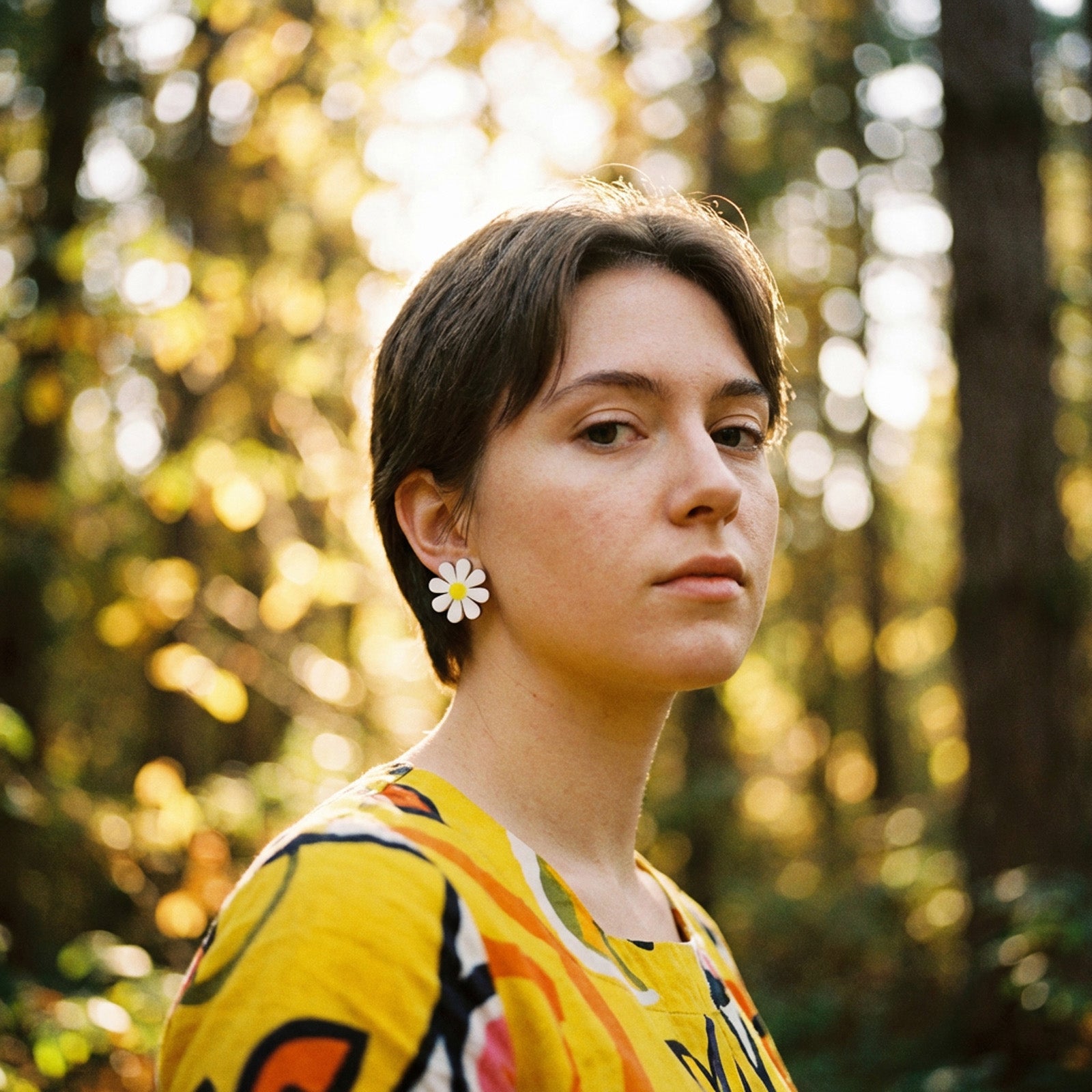 Cute and dainty daisy stud earrings with hypoallergenic titanium posts hand-made in NYC #color_white