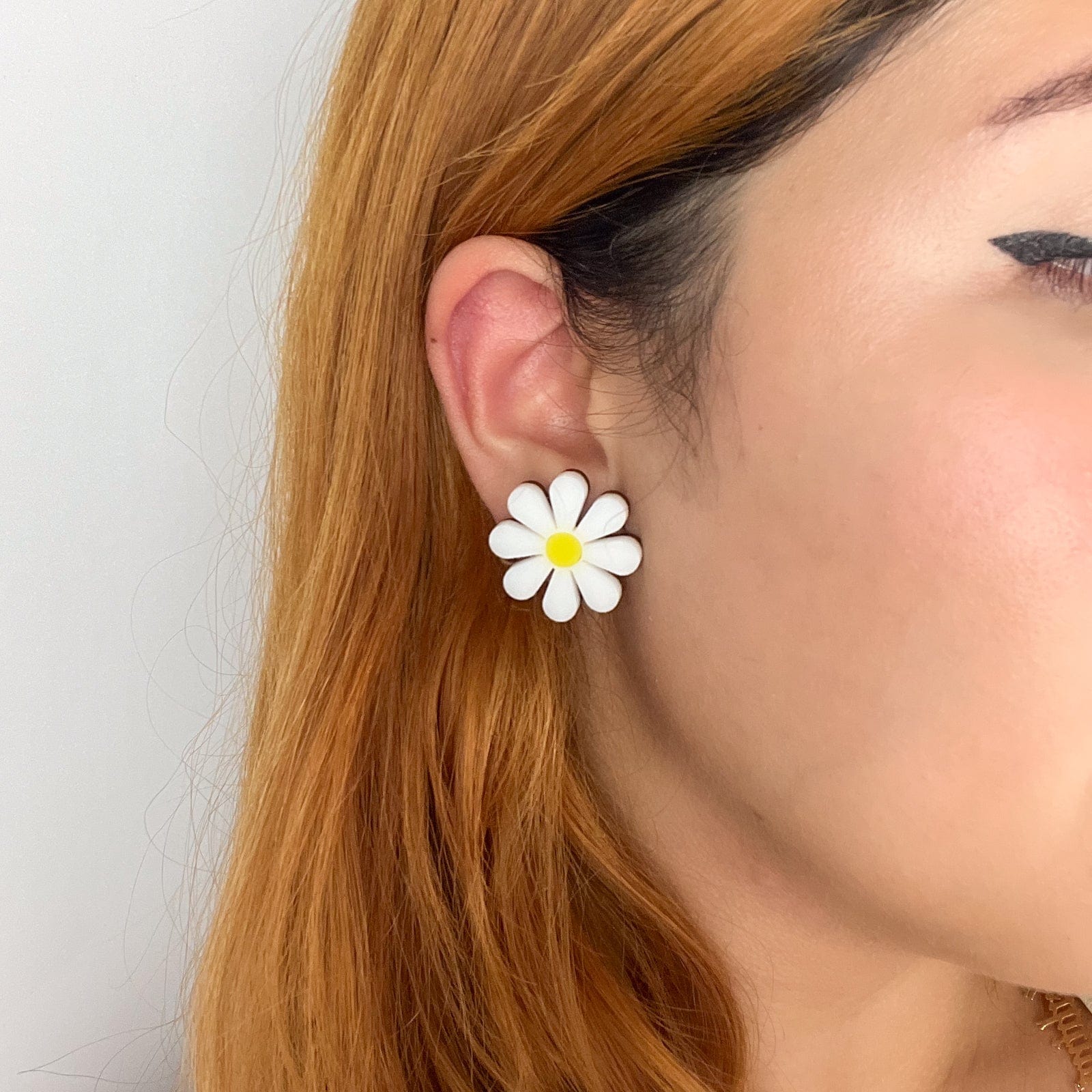 Cute and dainty daisy stud earrings with hypoallergenic titanium posts hand-made in NYC #color_white