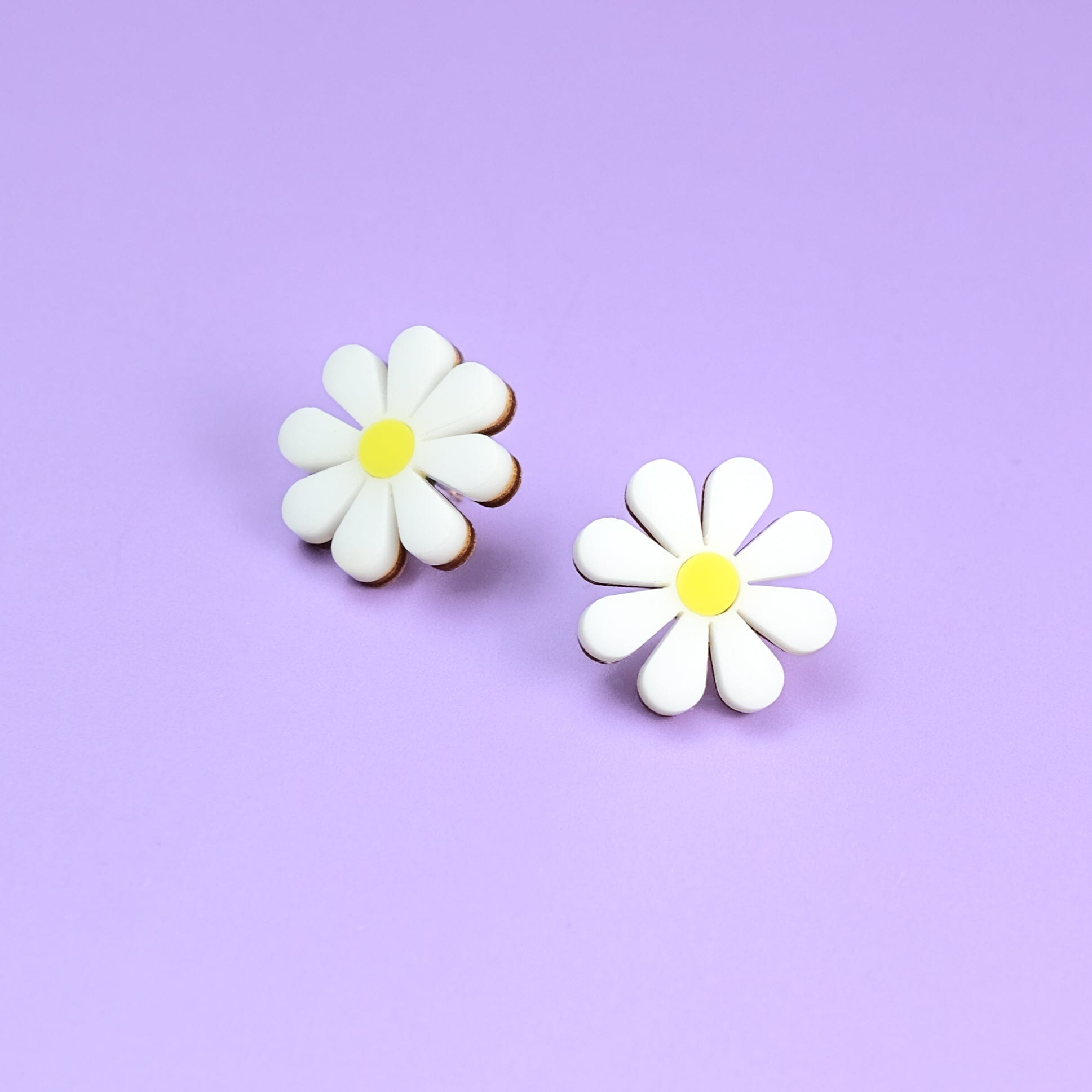 Cute and dainty daisy stud earrings with hypoallergenic titanium posts hand-made in NYC #color_white