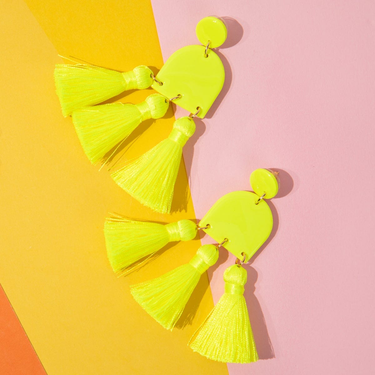 Funky and lightweight Dancing Domes Tassels dangly statement earrings in neon yellow #color_neon-yellow