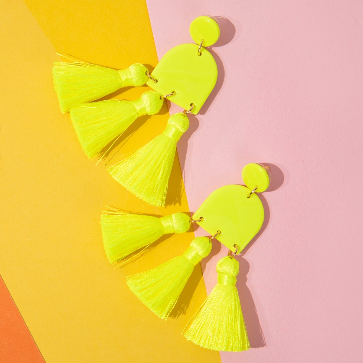 Dancing Domes Tassels dangly statement earrings in neon yellow #color_neon-yellow