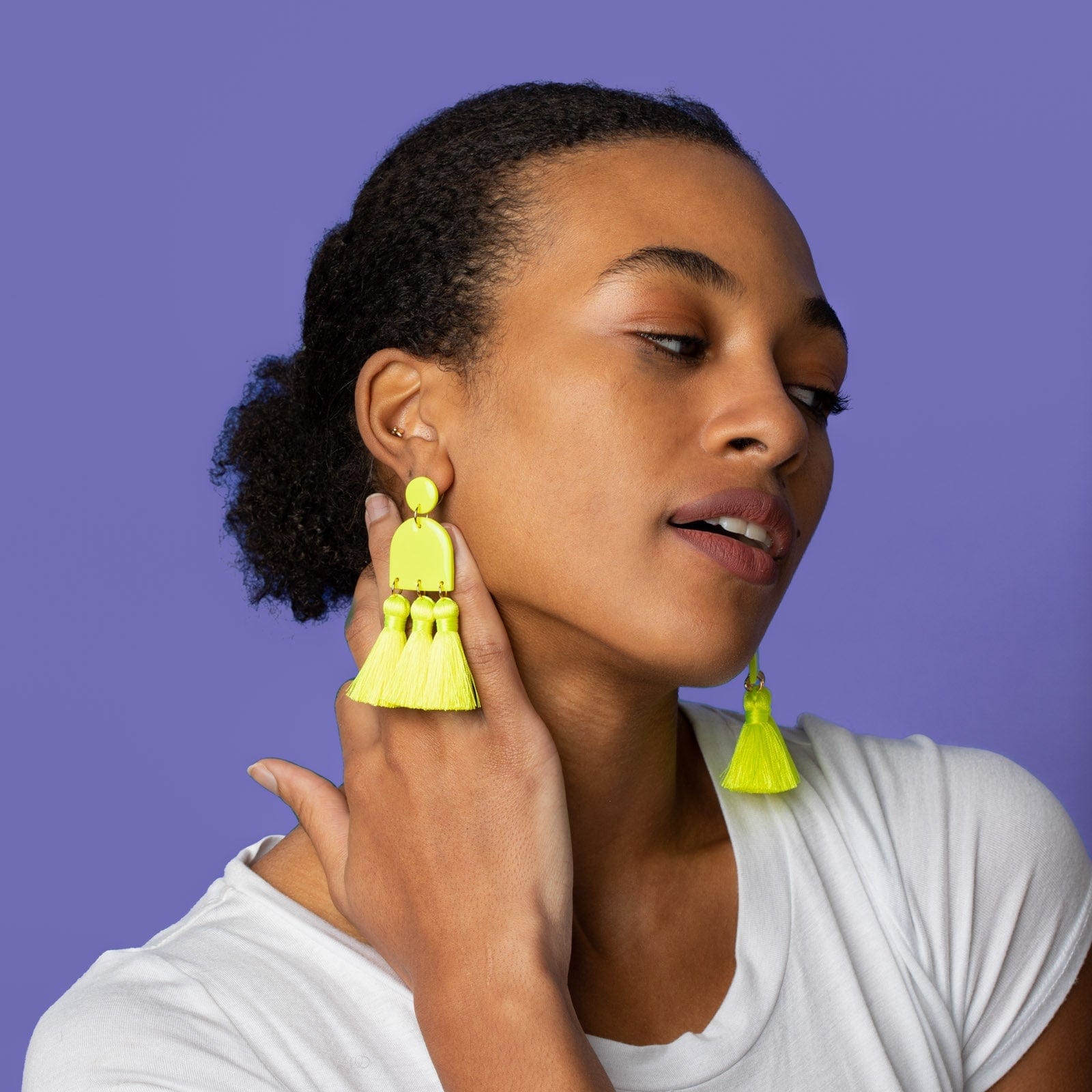 Funky and lightweight Dancing Domes Tassels dangly statement earrings in neon yellow #color_neon-yellow