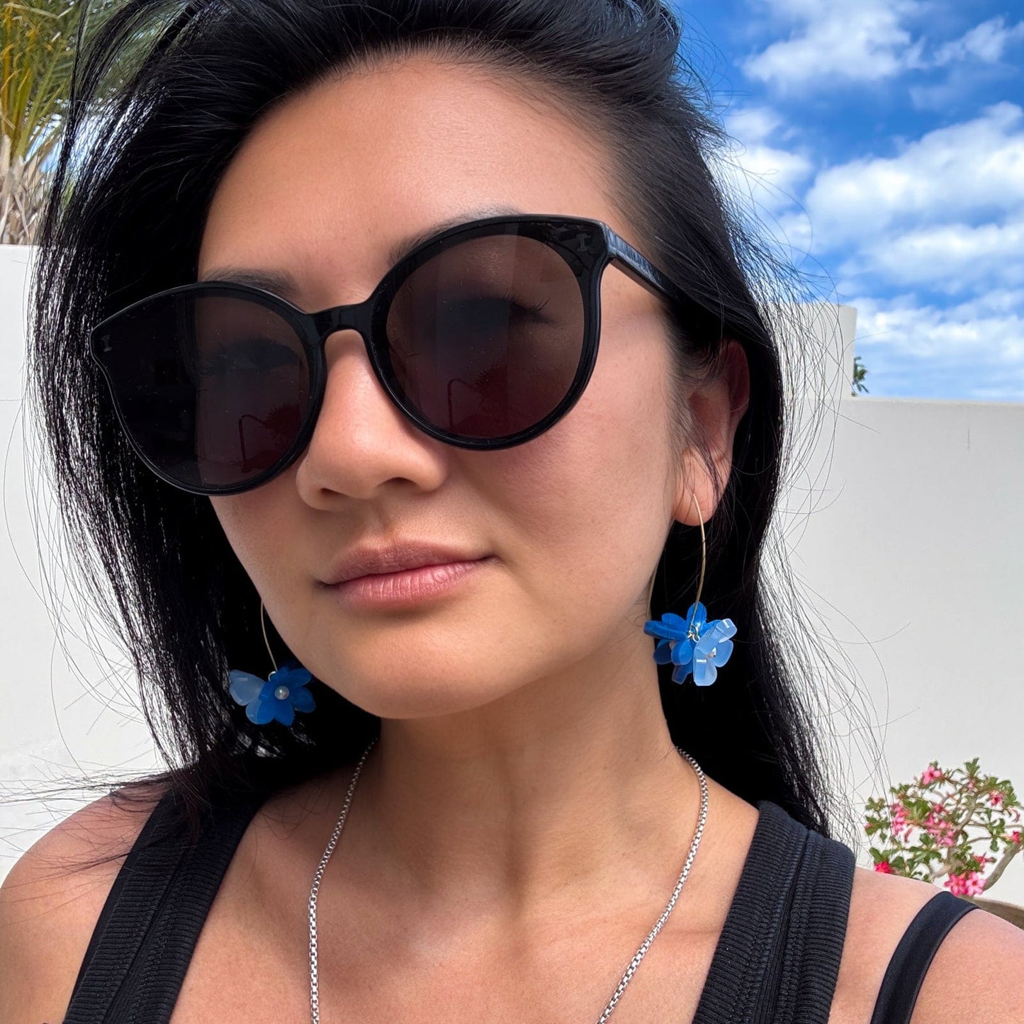Playful Flowerball dangly earrings with freshwater pearls in blue #color_blue