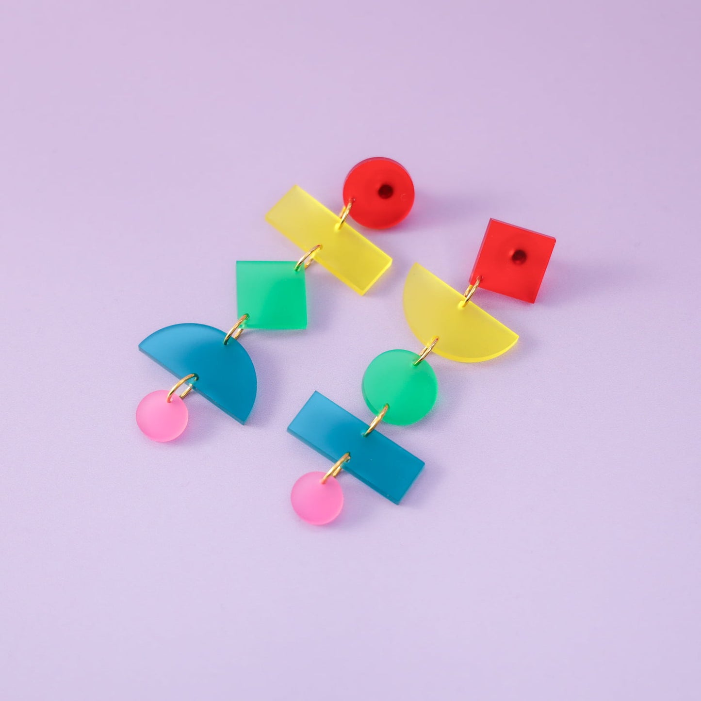 Rainbow geometric statement earrings, matte, lightweight, asymmetrical, stacked shapes with colorful links #color_rainbow
