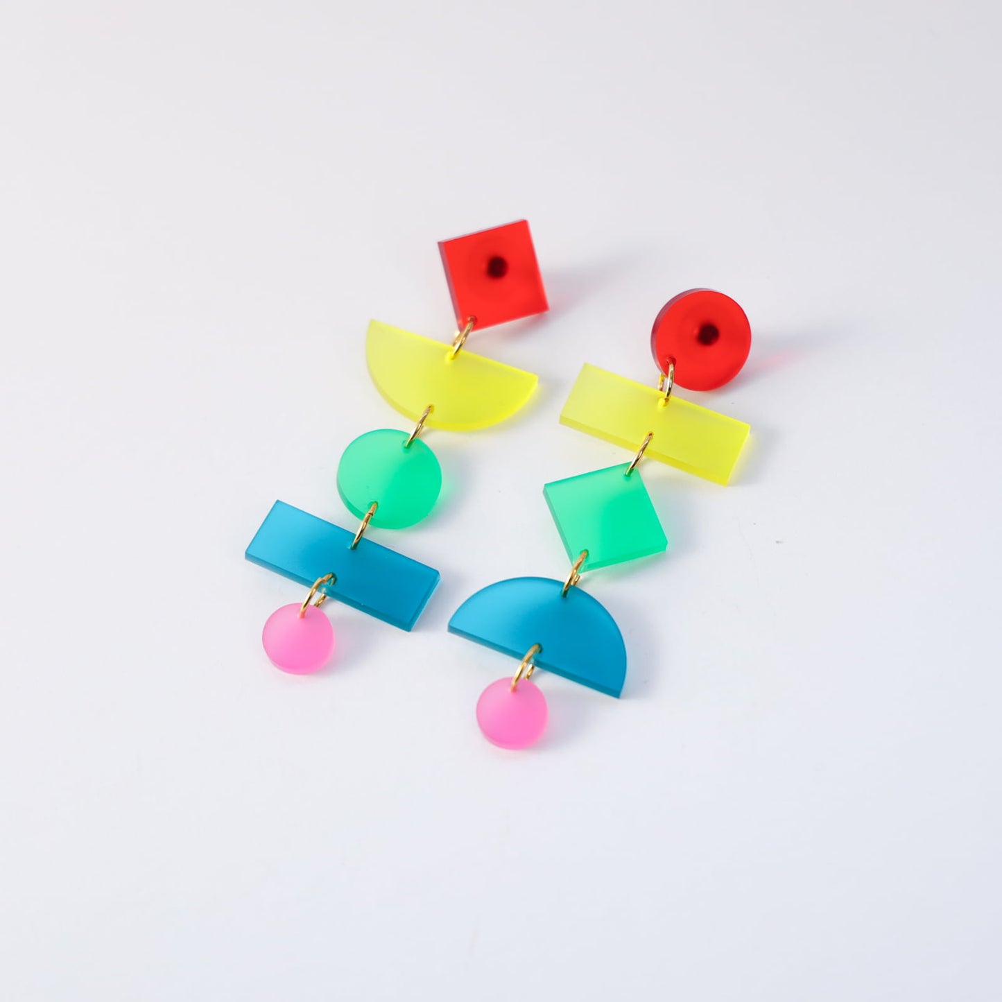 Rainbow geometric statement earrings, matte, lightweight, asymmetrical, stacked shapes with colorful links #color_rainbow