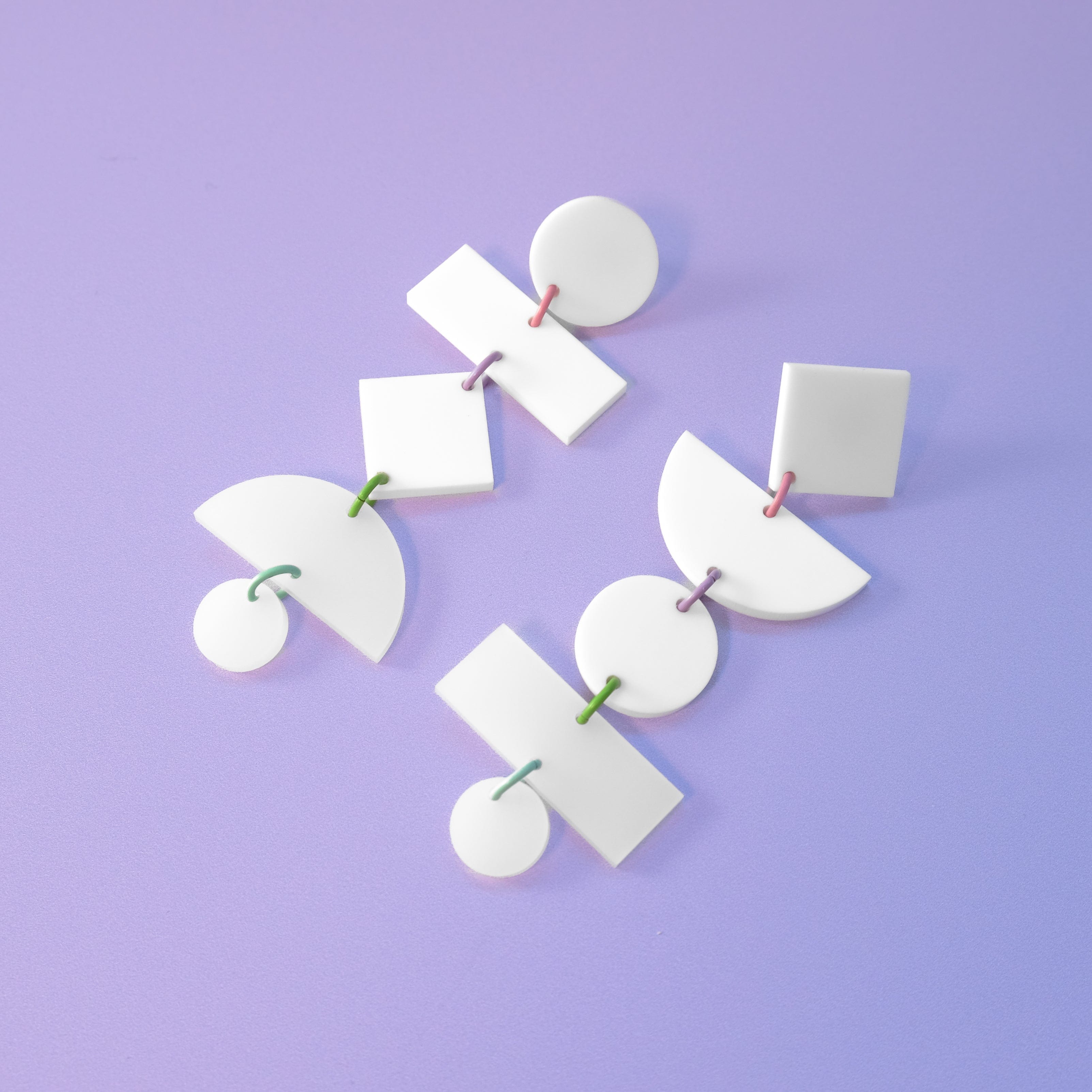 Asymmetrical translucent Geometric dangly statement earrings in white with pastel multi-color jump rings #color_white