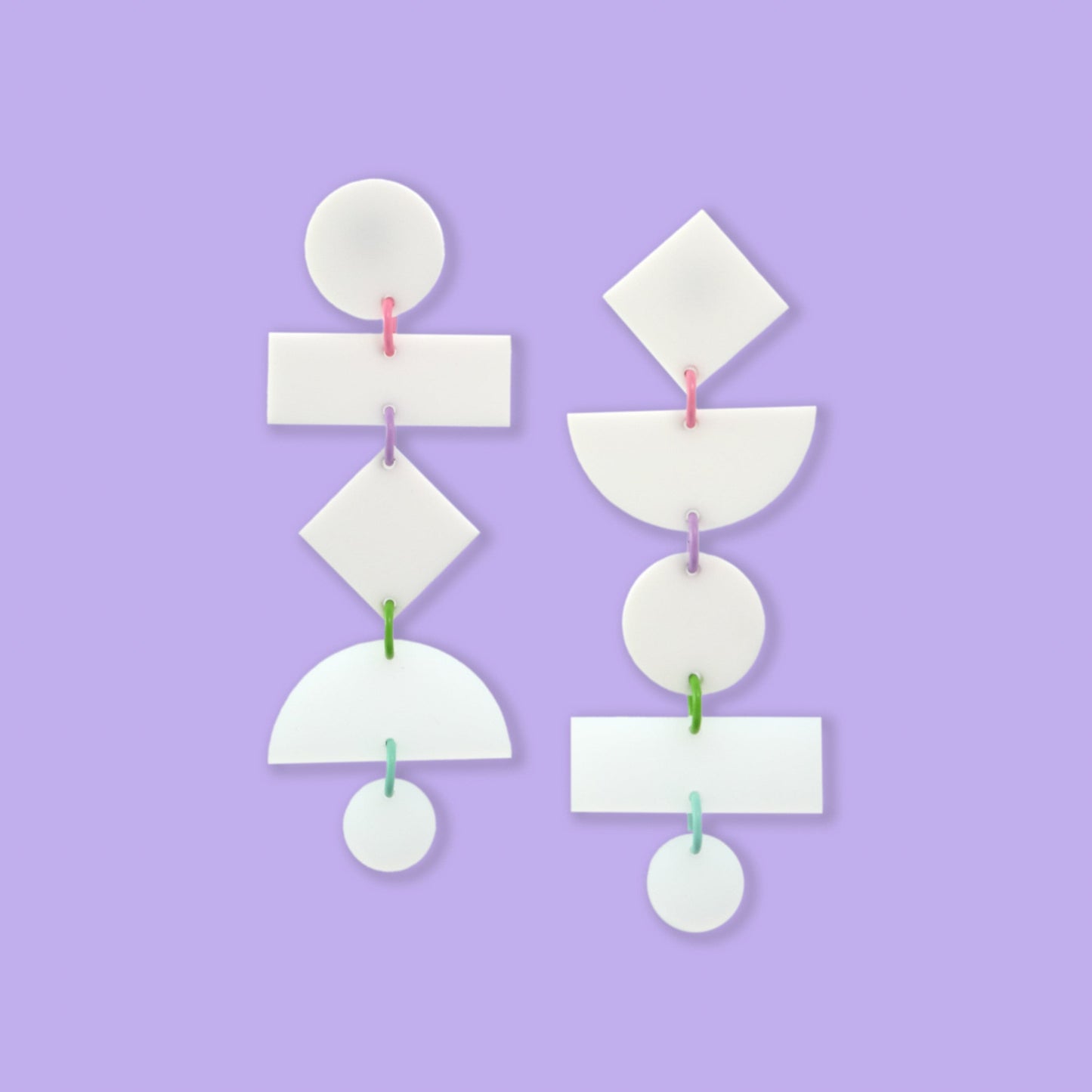 Asymmetrical translucent Geometric dangly statement earrings in white with pastel multi-color jump rings #color_white