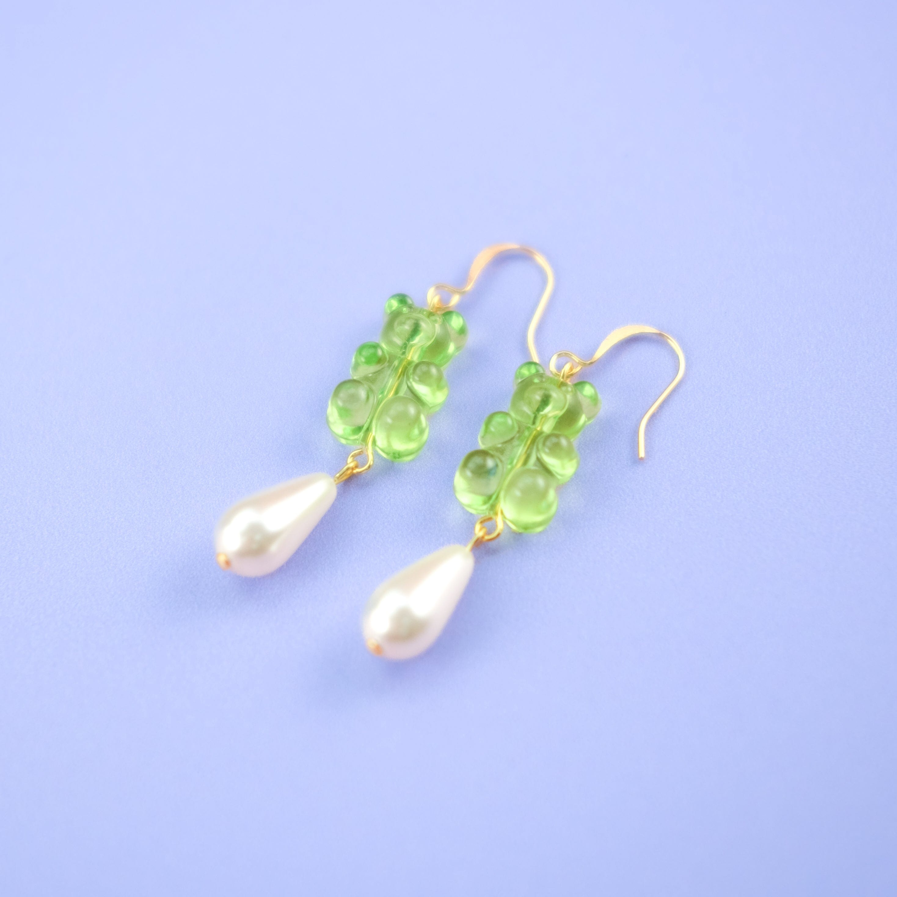 Nostalgic lime green gummy bear dangly earrings with elegant pearl drops #color_lime-green
