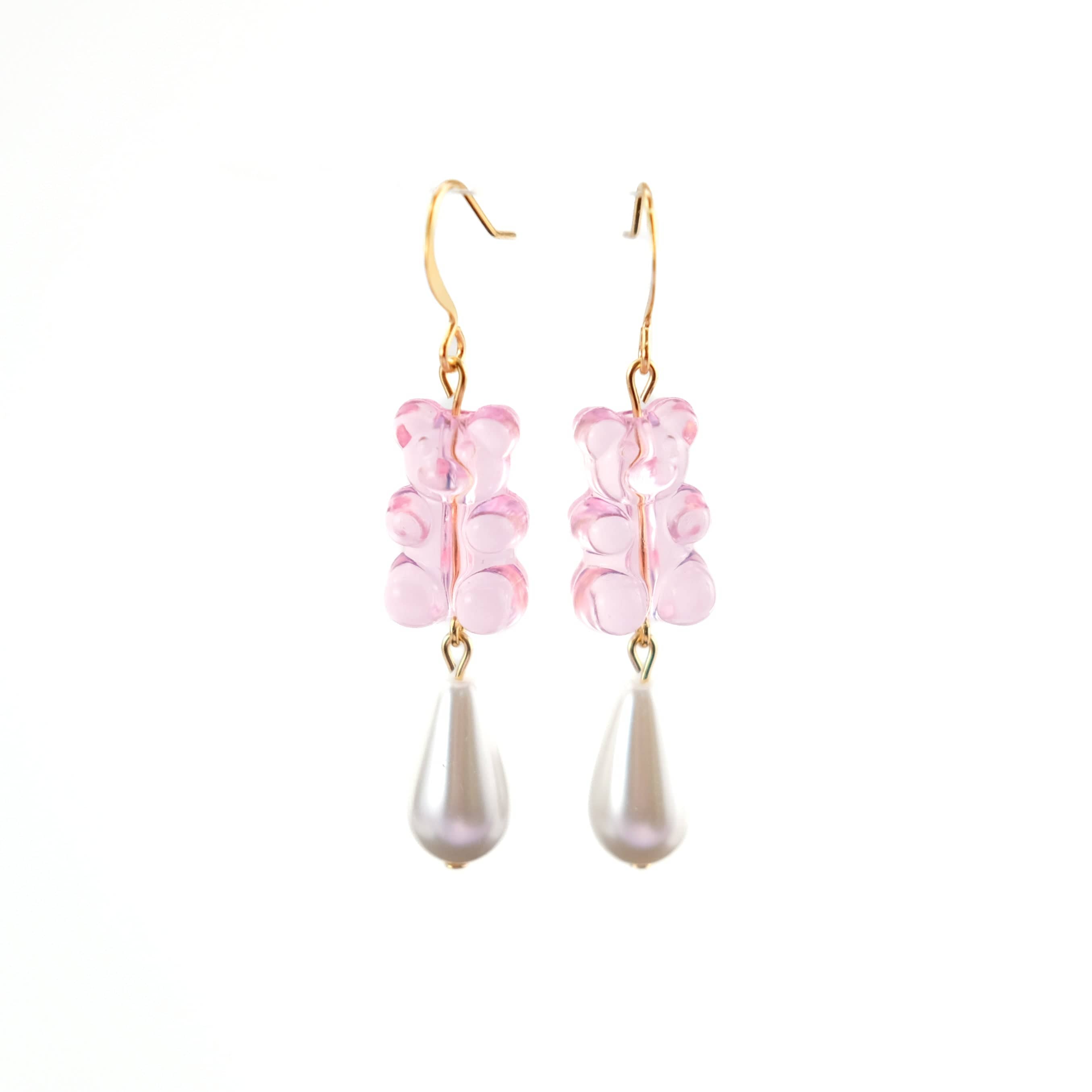 Nostalgic baby pink gummy bear dangly earrings with elegant pearl drops #color_baby-pink