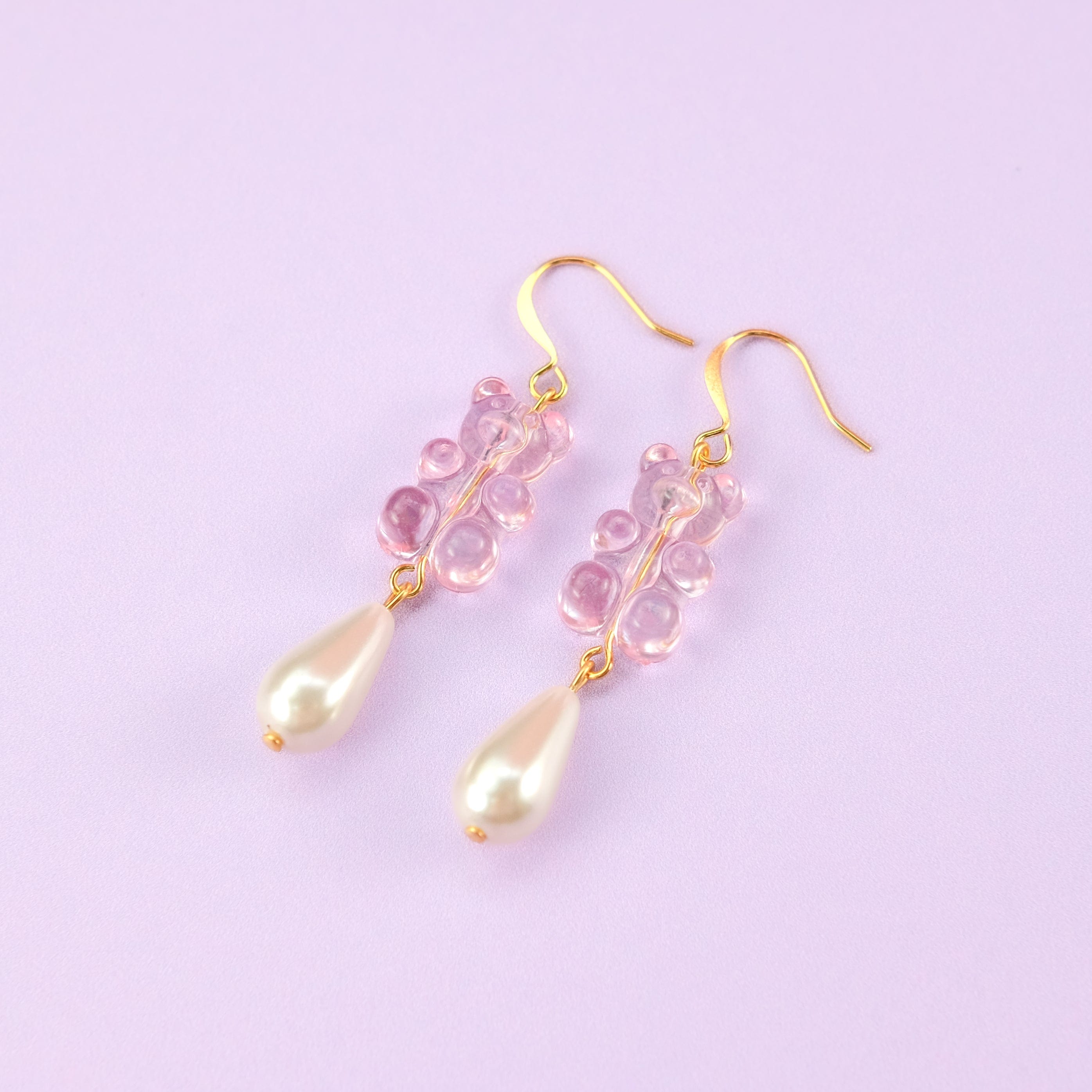Nostalgic baby pink gummy bear dangly earrings with elegant pearl drops #color_baby-pink