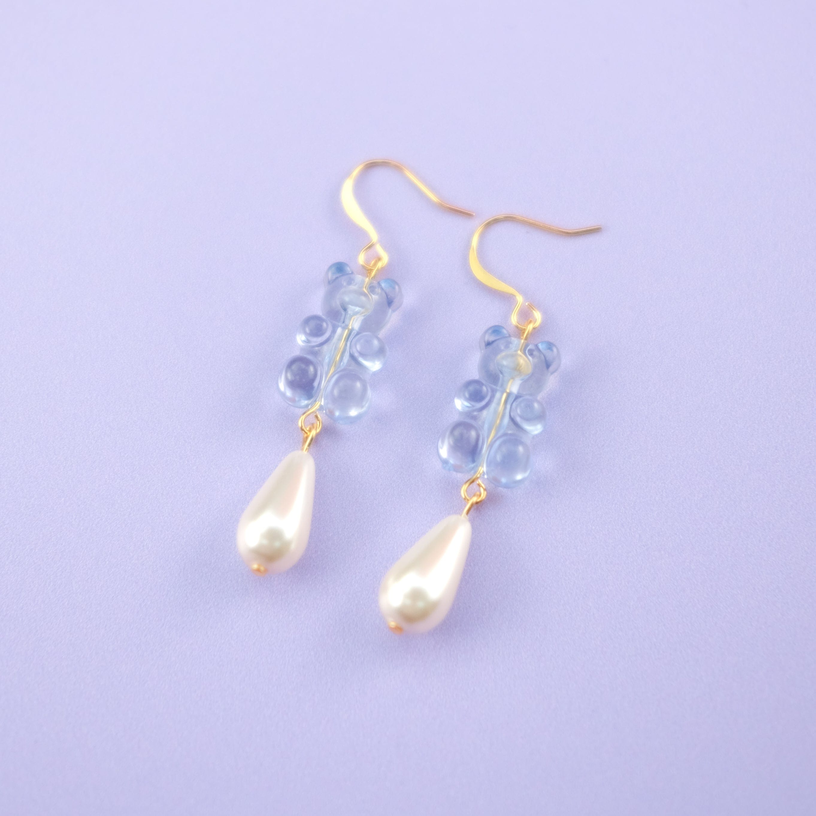 Nostalgic baby blue gummy bear dangly earrings with elegant pearl drops #color_baby-blue