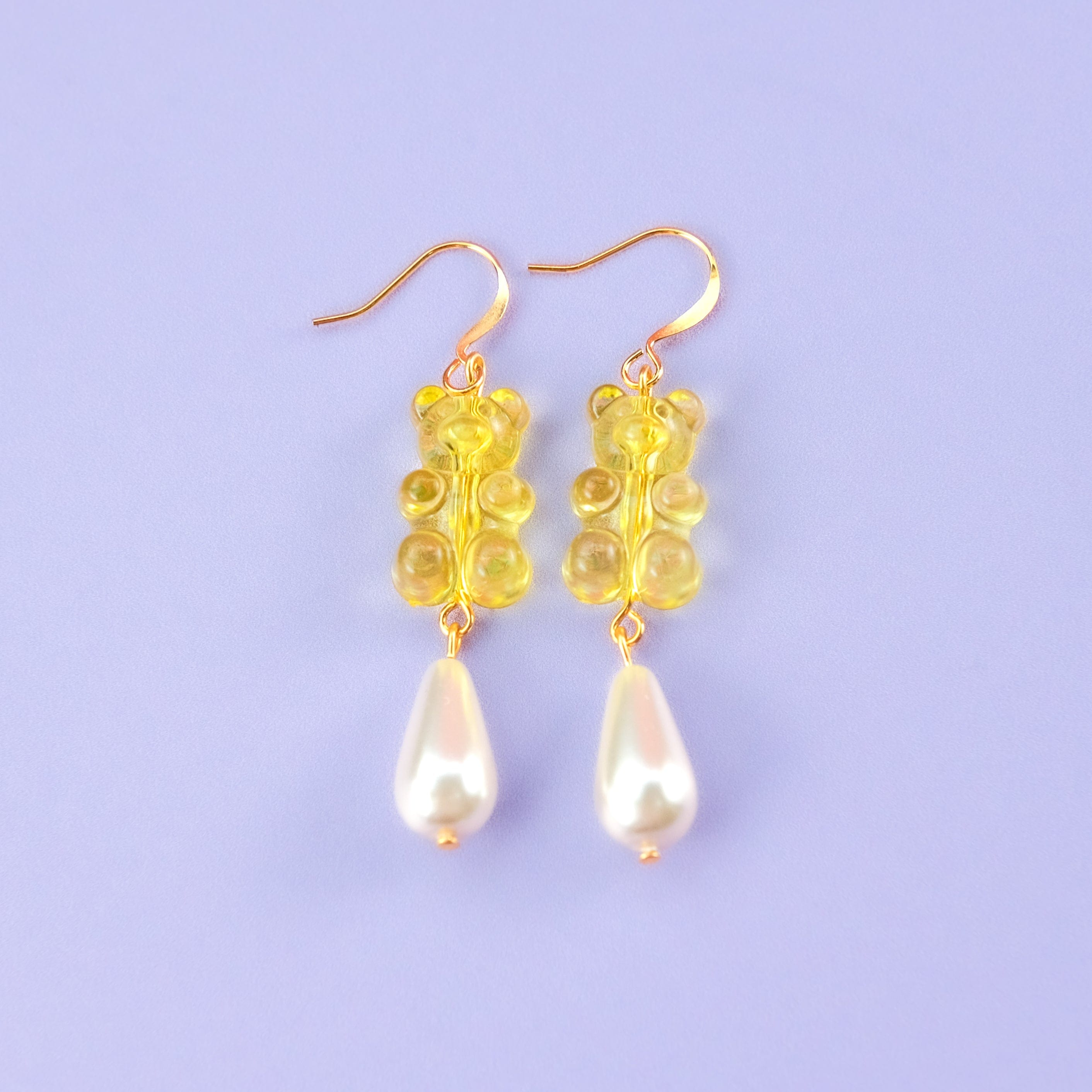 Nostalgic yellow gummy bear dangly earrings with elegant pearl drops #color_yellow