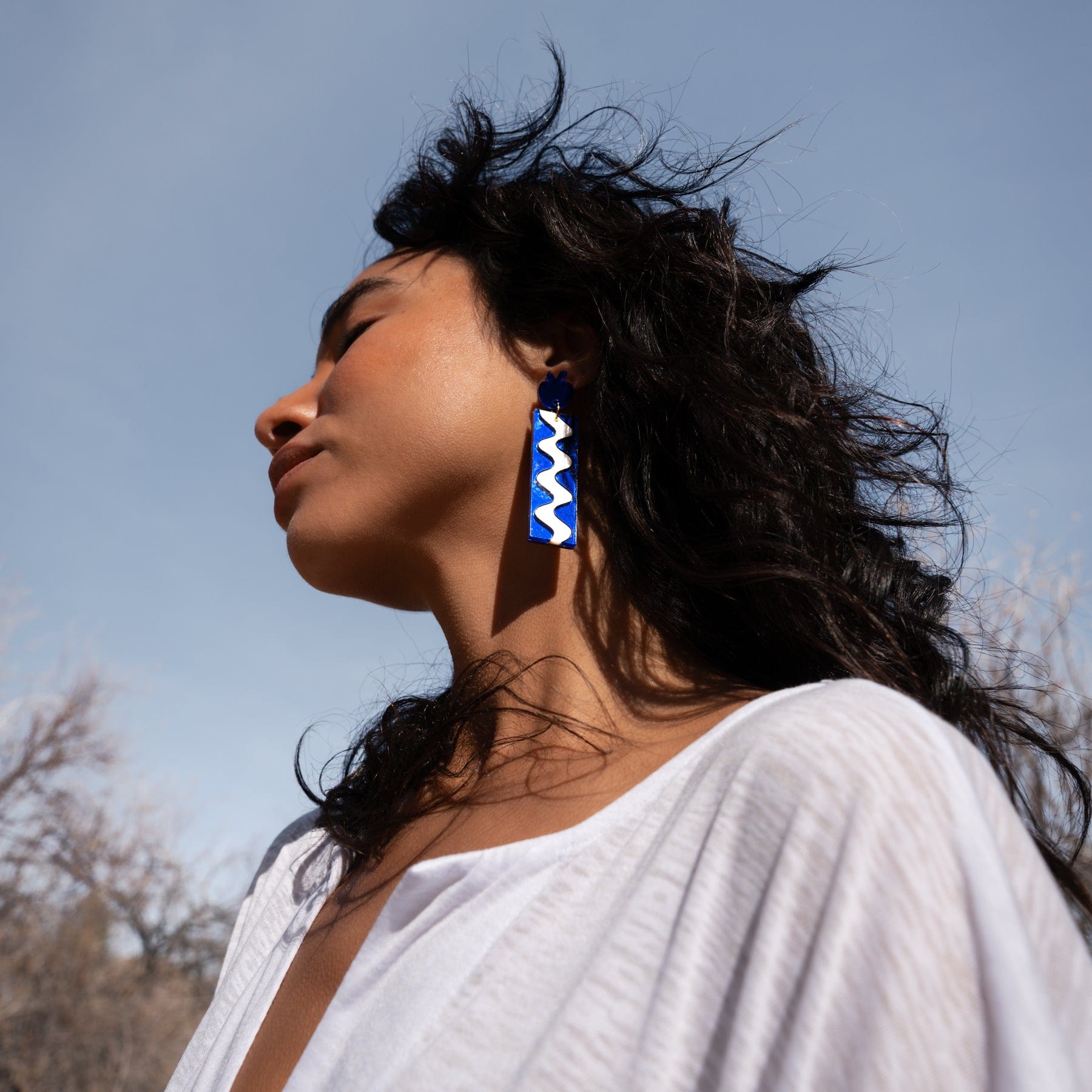 Elegant and funky Matisse Wave inspired dangly statement earrings with pomegranate stud. Hand-made in acrylic in NYC #color_blue-mirror