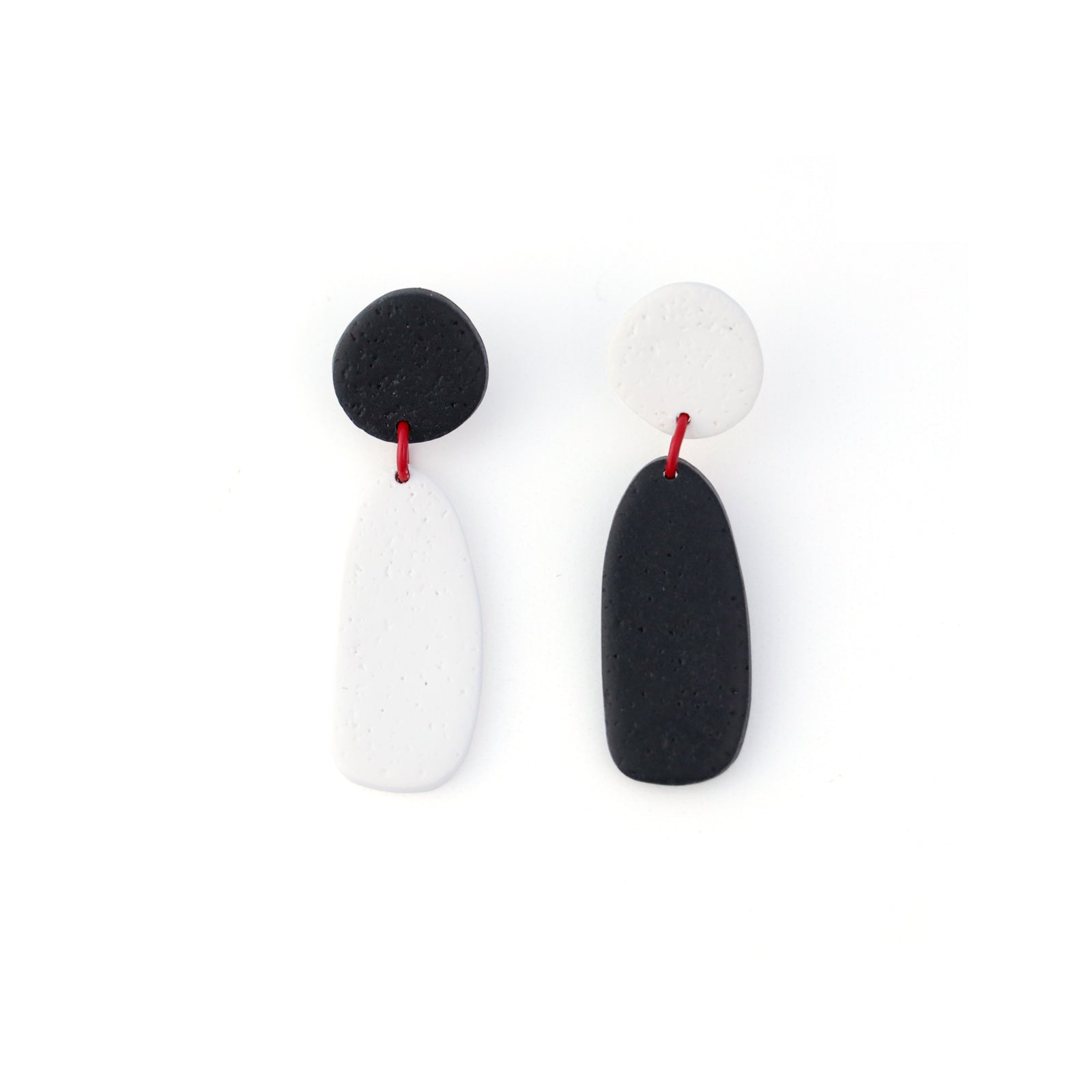 Artsy black and white Miro inspired lightweight dangly earrings with red accents #color_black-and-white