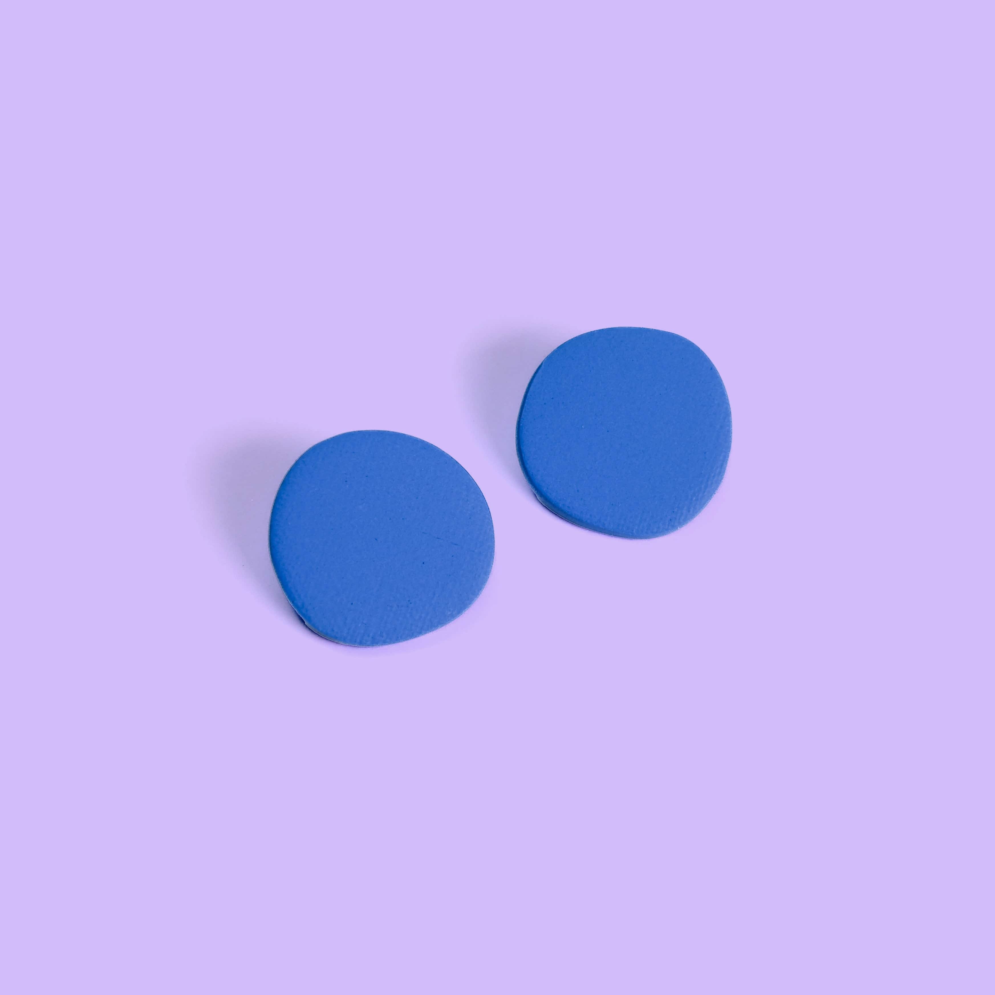 Miro inspired organic round shaped studs with canvas texture in blue #color_blue