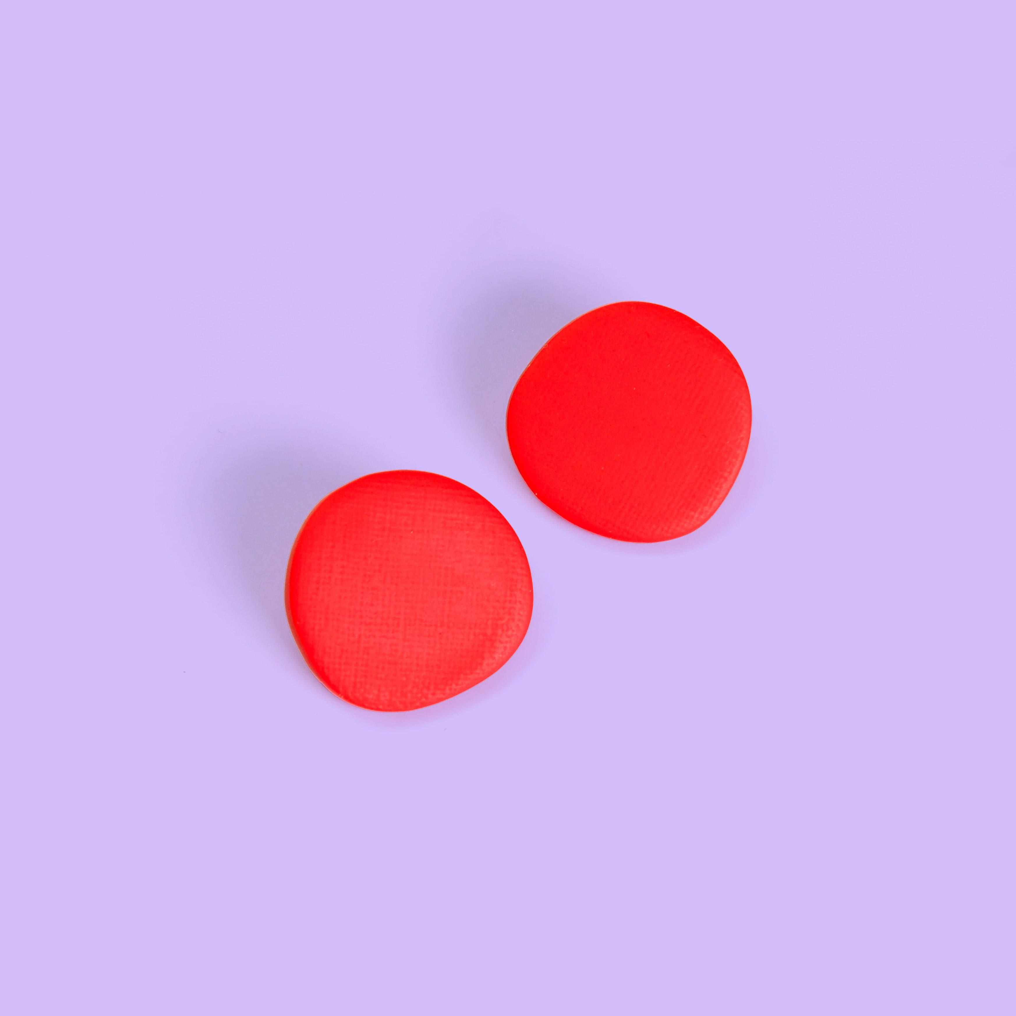 Miro inspired organic round shaped studs with canvas texture in red #color_red