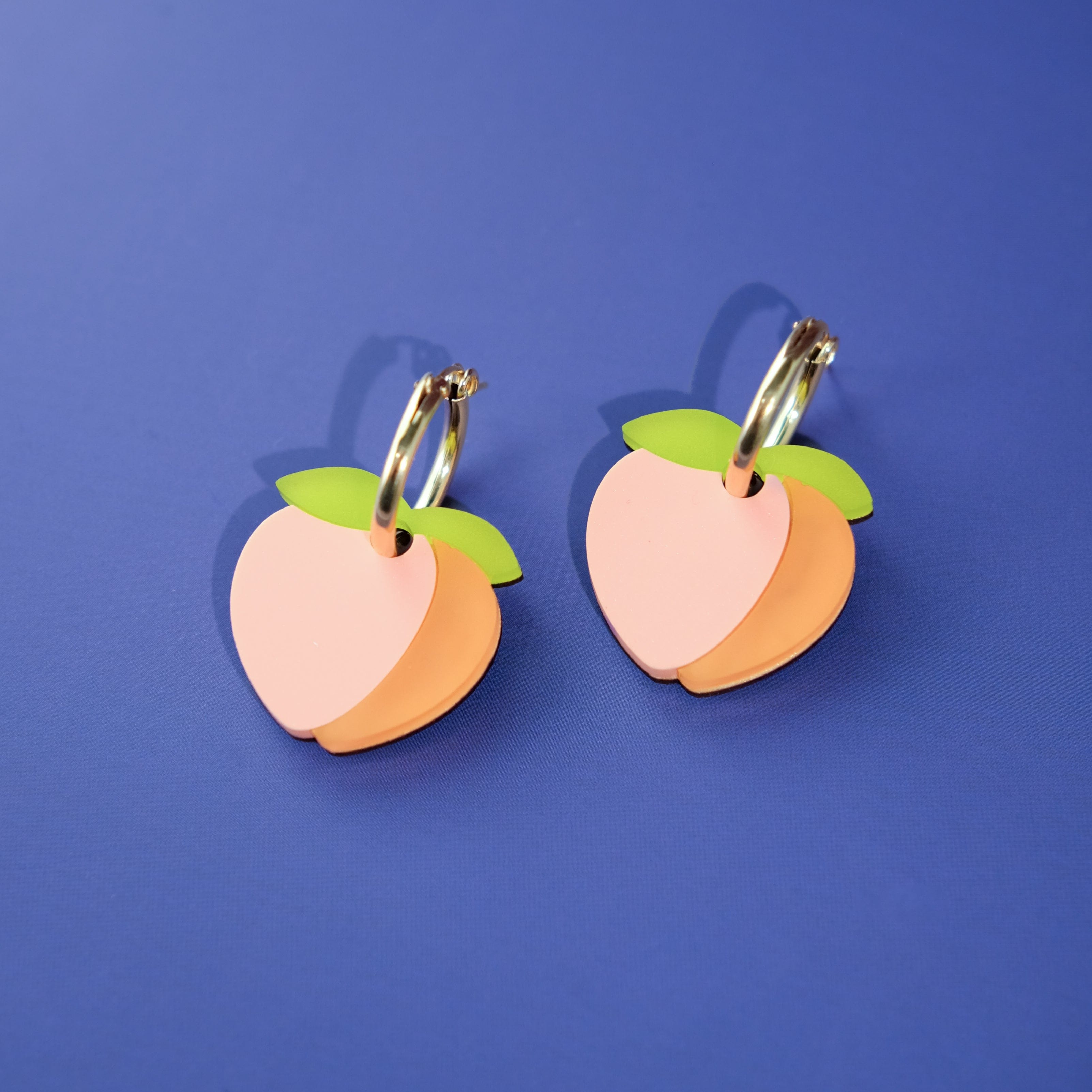 Cute peach dangly hoop earrings