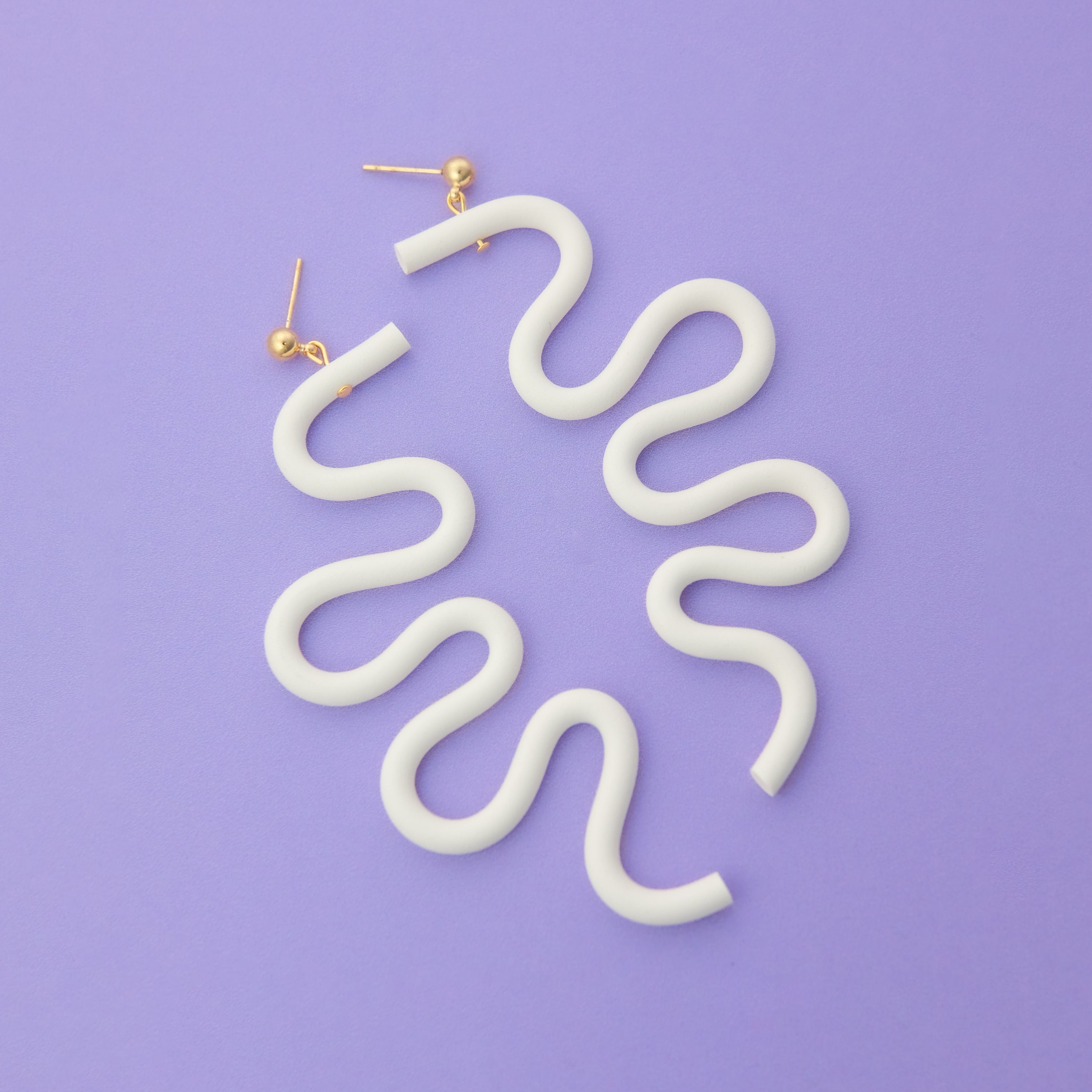 Tube Squiggle dangly statement earrings small in white #color_white
