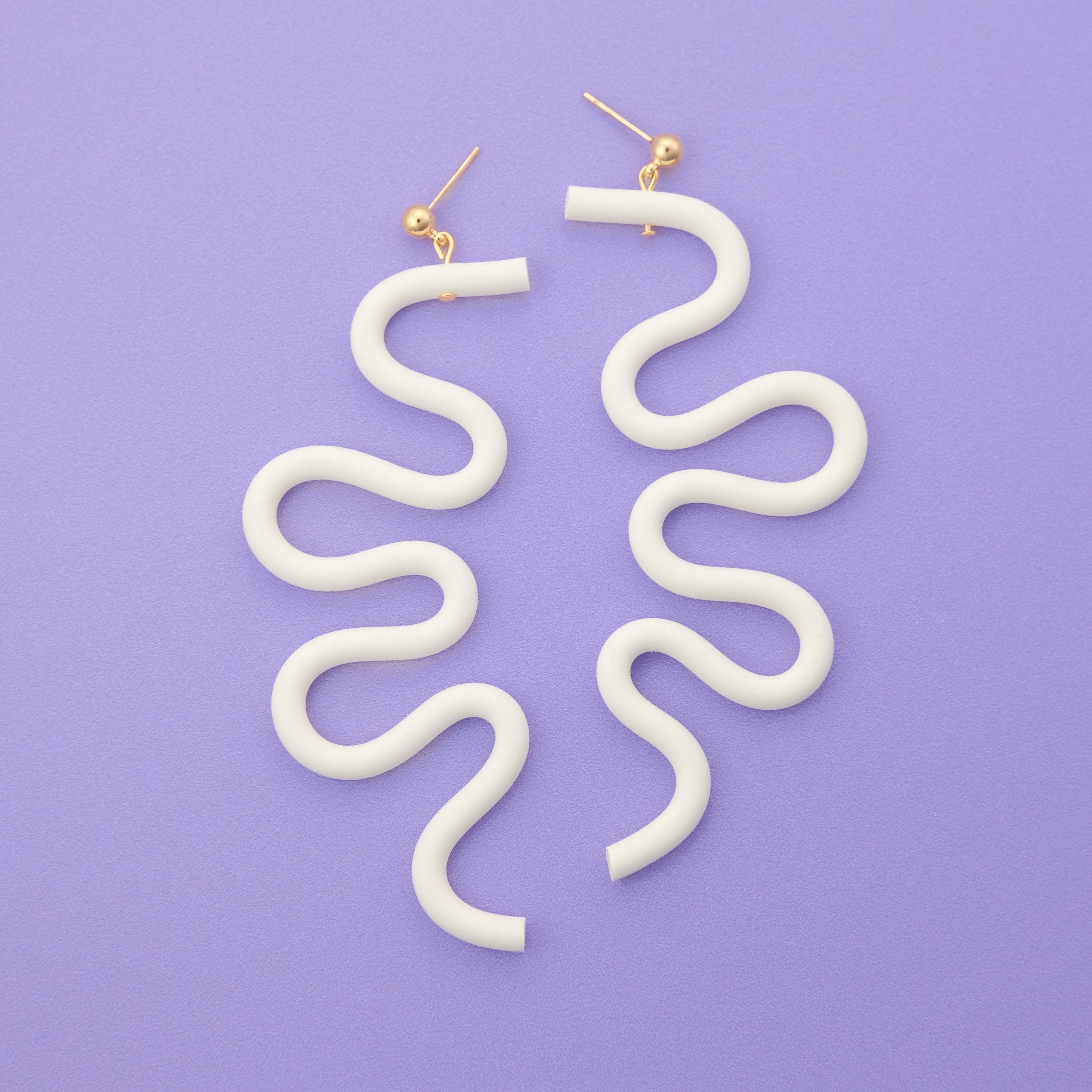 Tube Squiggle dangly earrings small in white #color_white