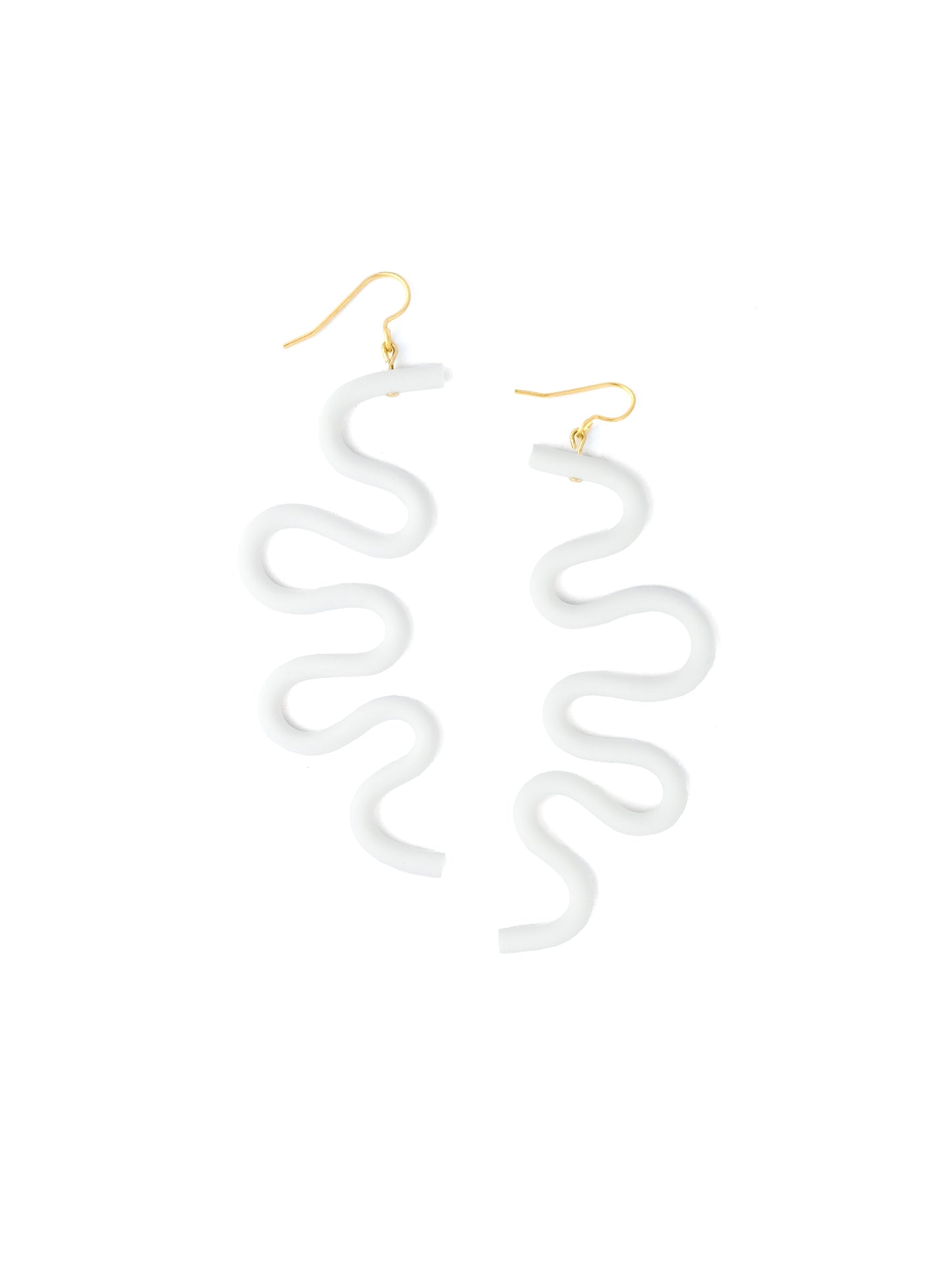 White squiggle earrings, matte, lightweight, tubular, abstract wavy silhouette on gold hooks #color_white