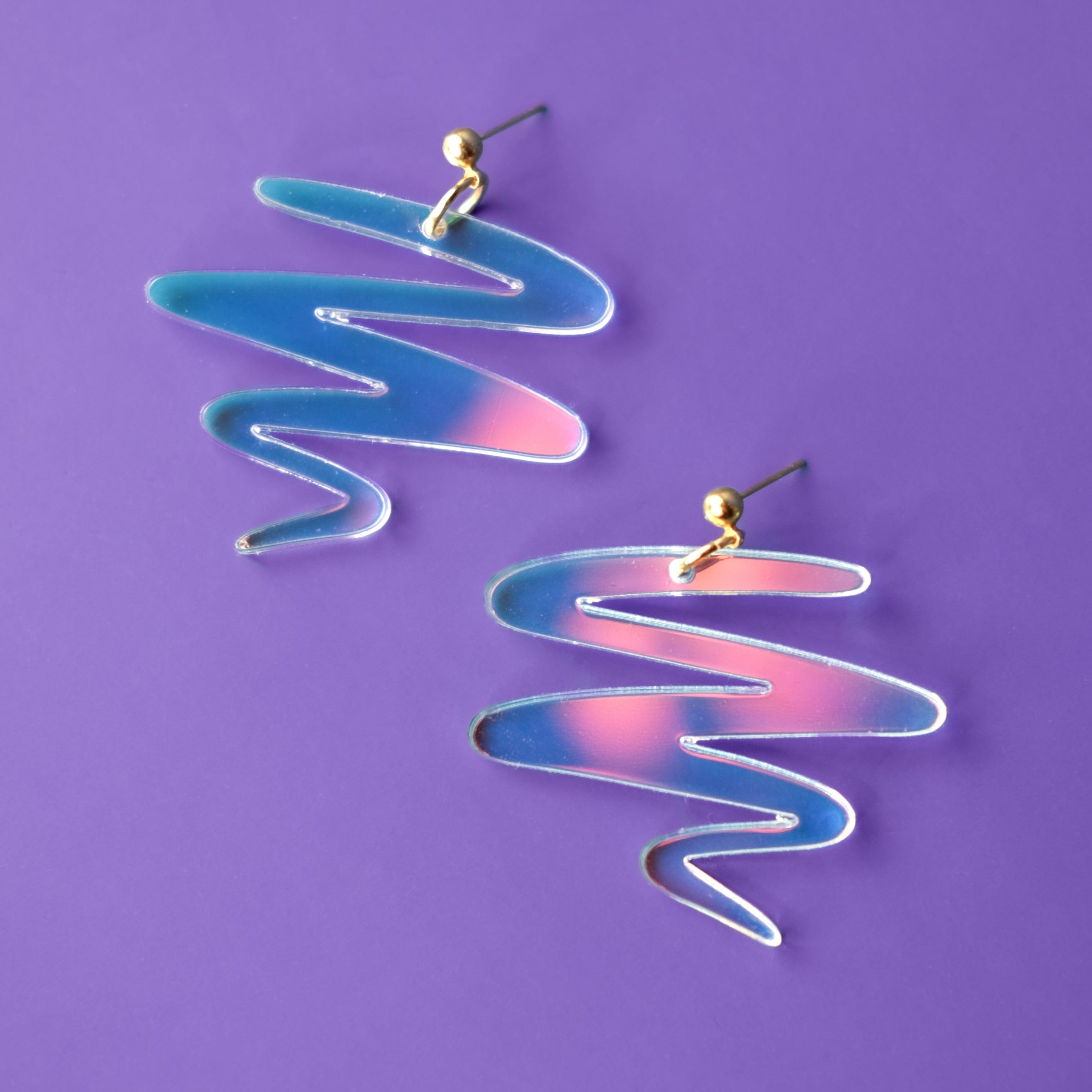 Cute Squiggle dangly earrings in iridescent #color_iridescent