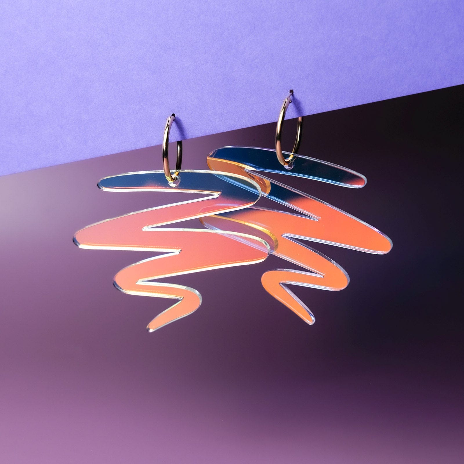 Iridescent squiggle statement earrings #color_iridescent