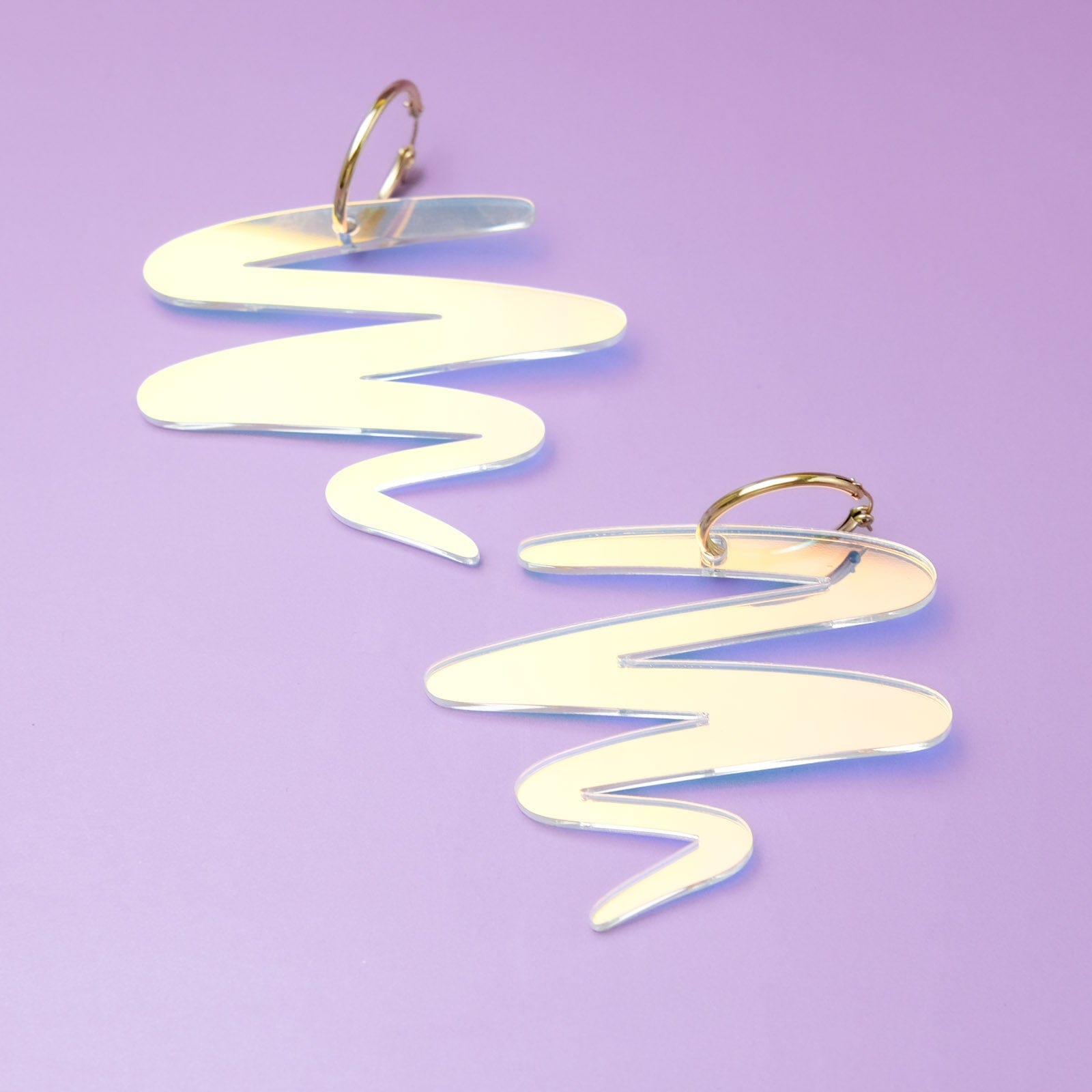 Iridescent squiggle statement earrings #color_iridescent