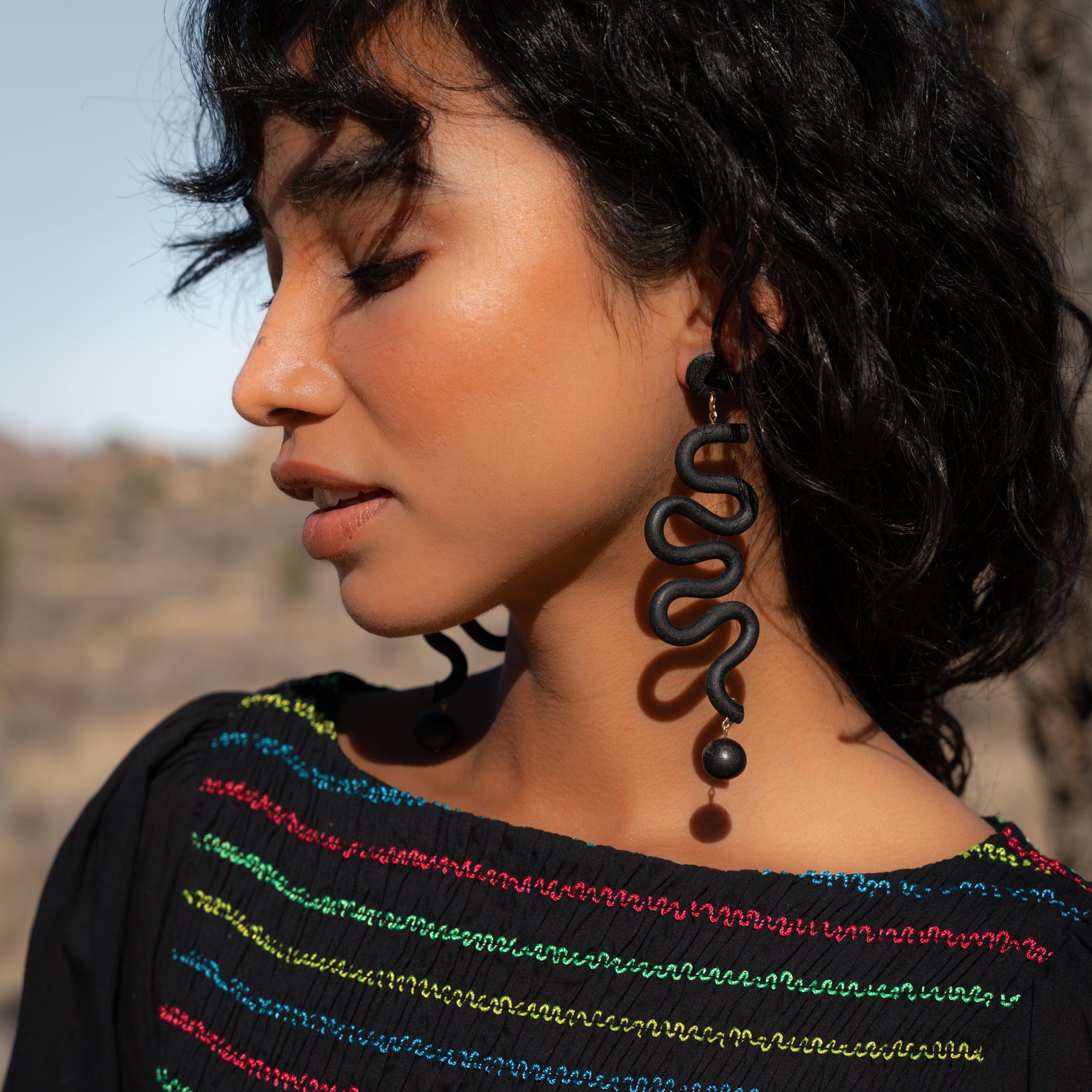 Tube Squiggles Dangly Funky Earrings in black #color_black