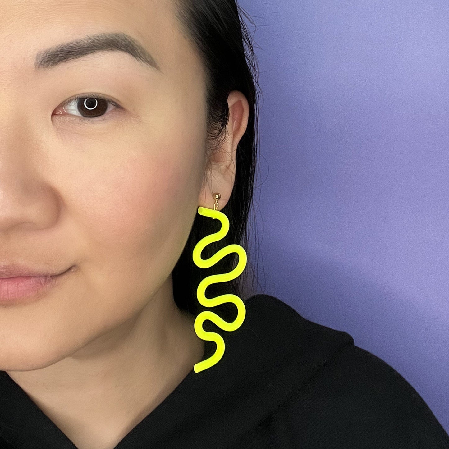 Tube Squiggle dangly statement earrings small in neon yellow #color_neon-yellow